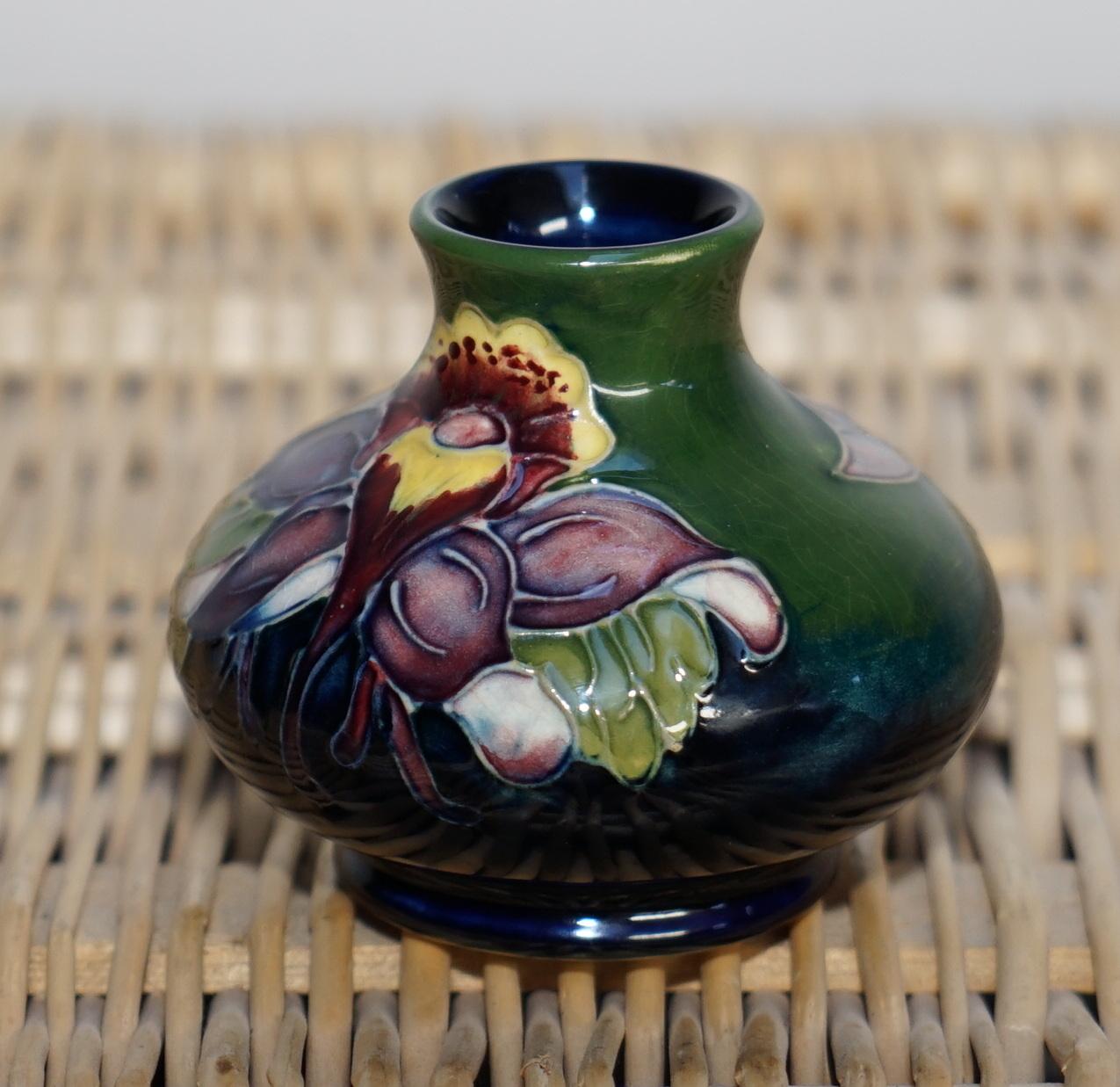 We are delighted to offer for auction this new Moorcroft pottery small flower vase

A very small vase, ideal for a single flower on a desk

The condition is new and unboxed, it was bought as a gift and never used

Dimensions:

Height