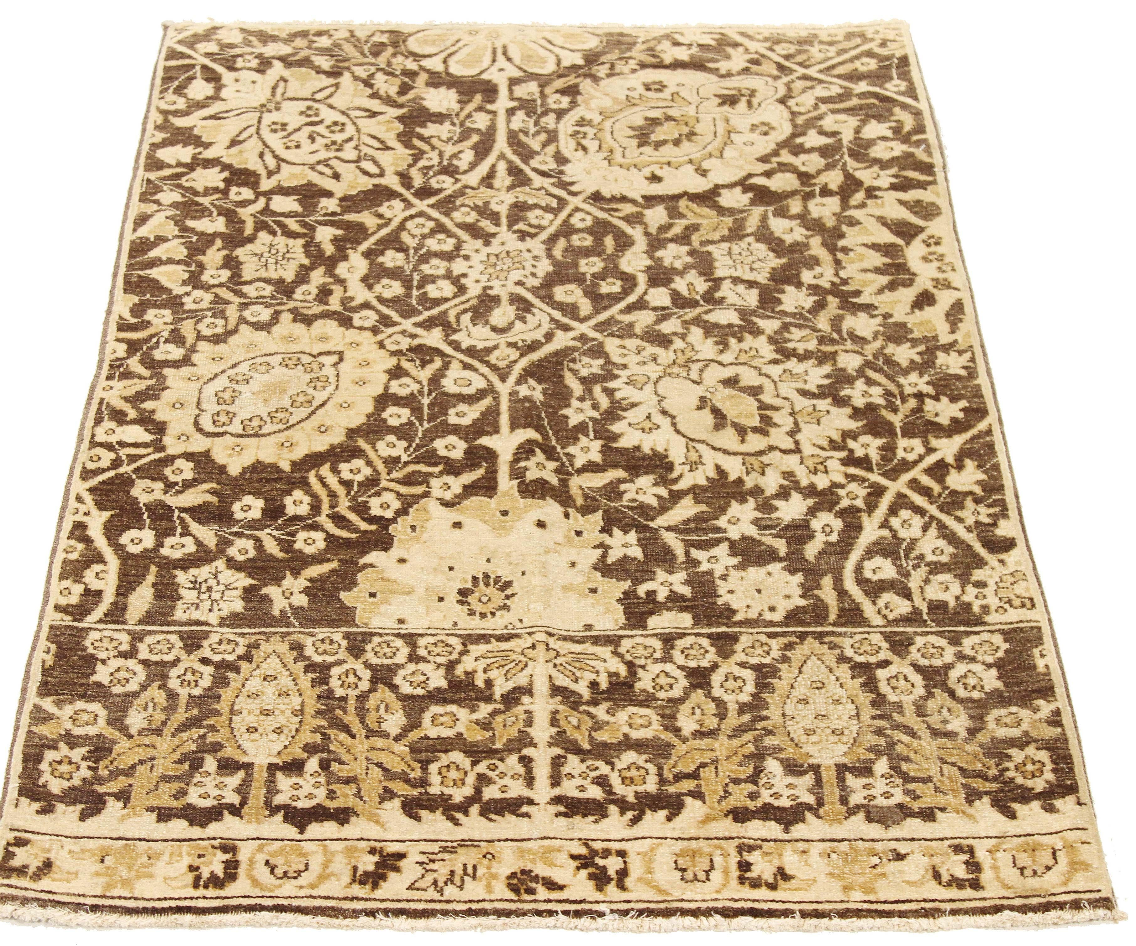 Contemporary Persian rug handwoven from the finest sheep’s wool and colored with all-natural vegetable dyes that are safe for humans and pets. It’s a traditional Tabriz weaving featuring a lovely ensemble of floral designs in beige and brown over an