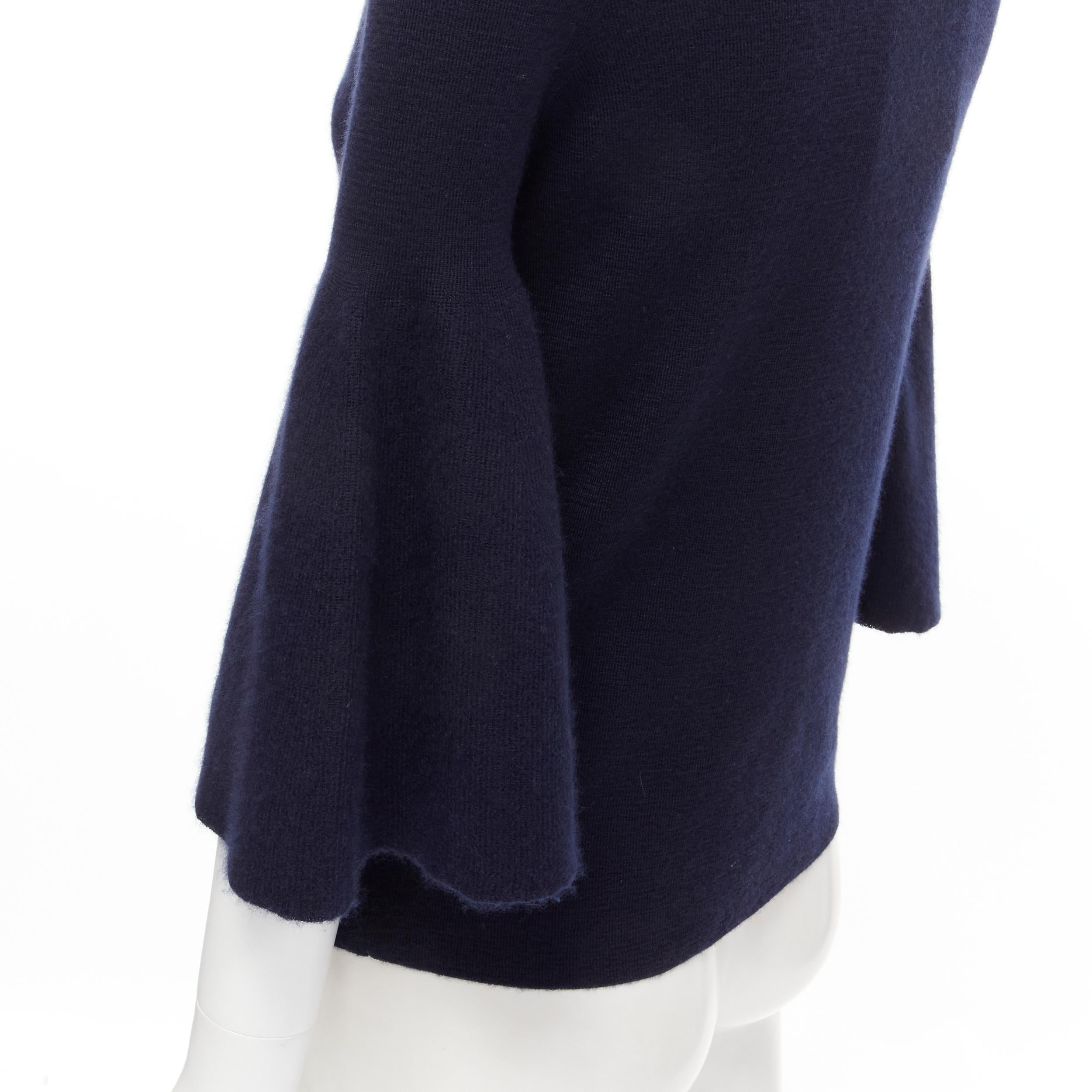 new THE ROW Adara dark navy cashmere silk bell sleeve turtleneck sweater S 
Reference: MELK/A00039 
Brand: The Row 
Material: Cashmere 
Color: Navy 
Pattern: Solid 
Made in: Italy 

CONDITION: 
Condition: New with tags. 

SIZING: 
Designer Size: