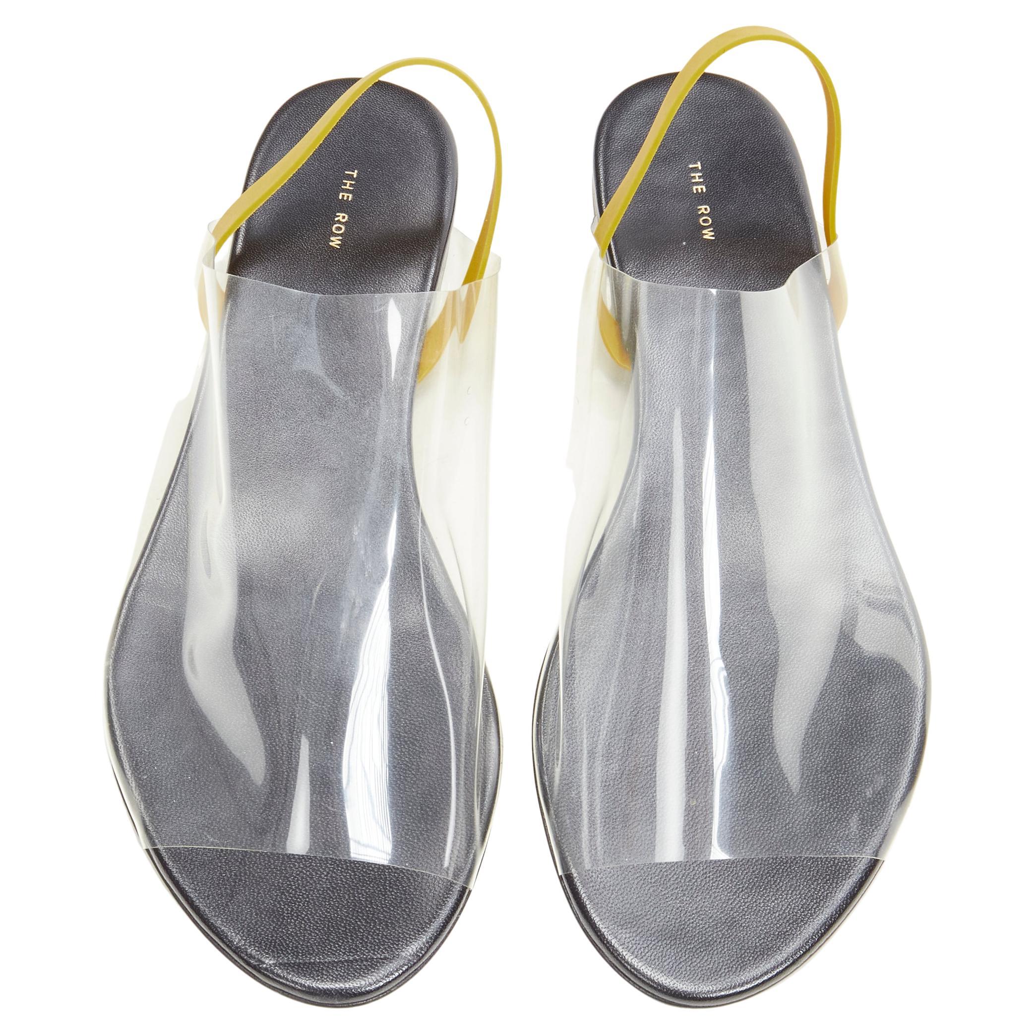 new THE ROW Clear PVC open toe yellow rubber slingback flat sandal EU36.5
Brand: The Row
Designer: Mary Kate and Ashley Olsen
Model: Clear Sandal
Material: PVC
Color: Clear
Pattern: Solid
Closure: Slingback
Extra Detail: Soft clear PVC wide. Open