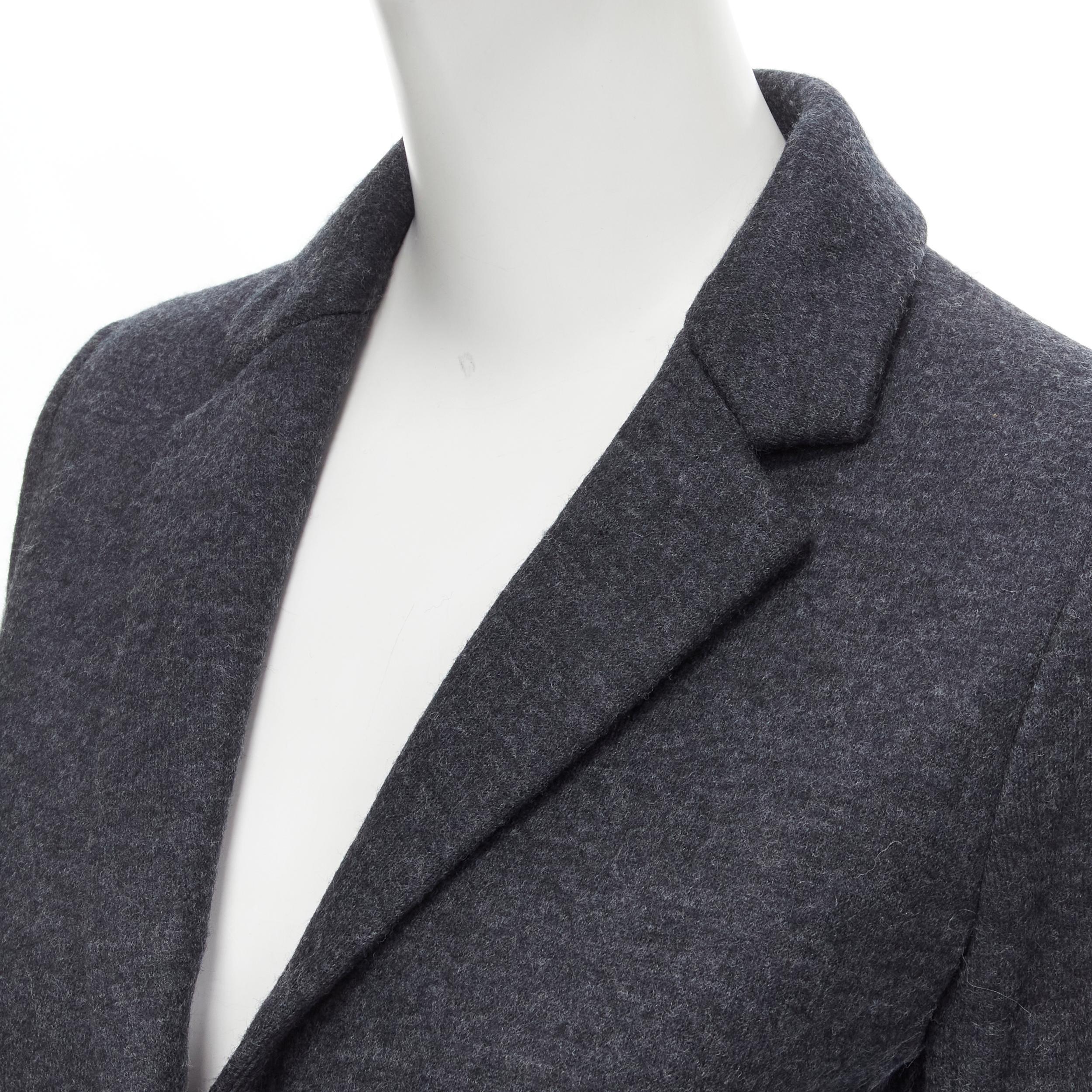 new THE ROW Haven dark charcoal grey virgin wool 3/4 sleeve short blazer US2 XS 
Reference: MELK/A00012 
Brand: The Row 
Material: Virgin wool 
Color: Grey 
Pattern: Solid 
Closure: Button 
Extra Detail: unlined. 
Made in: USA 

CONDITION:
