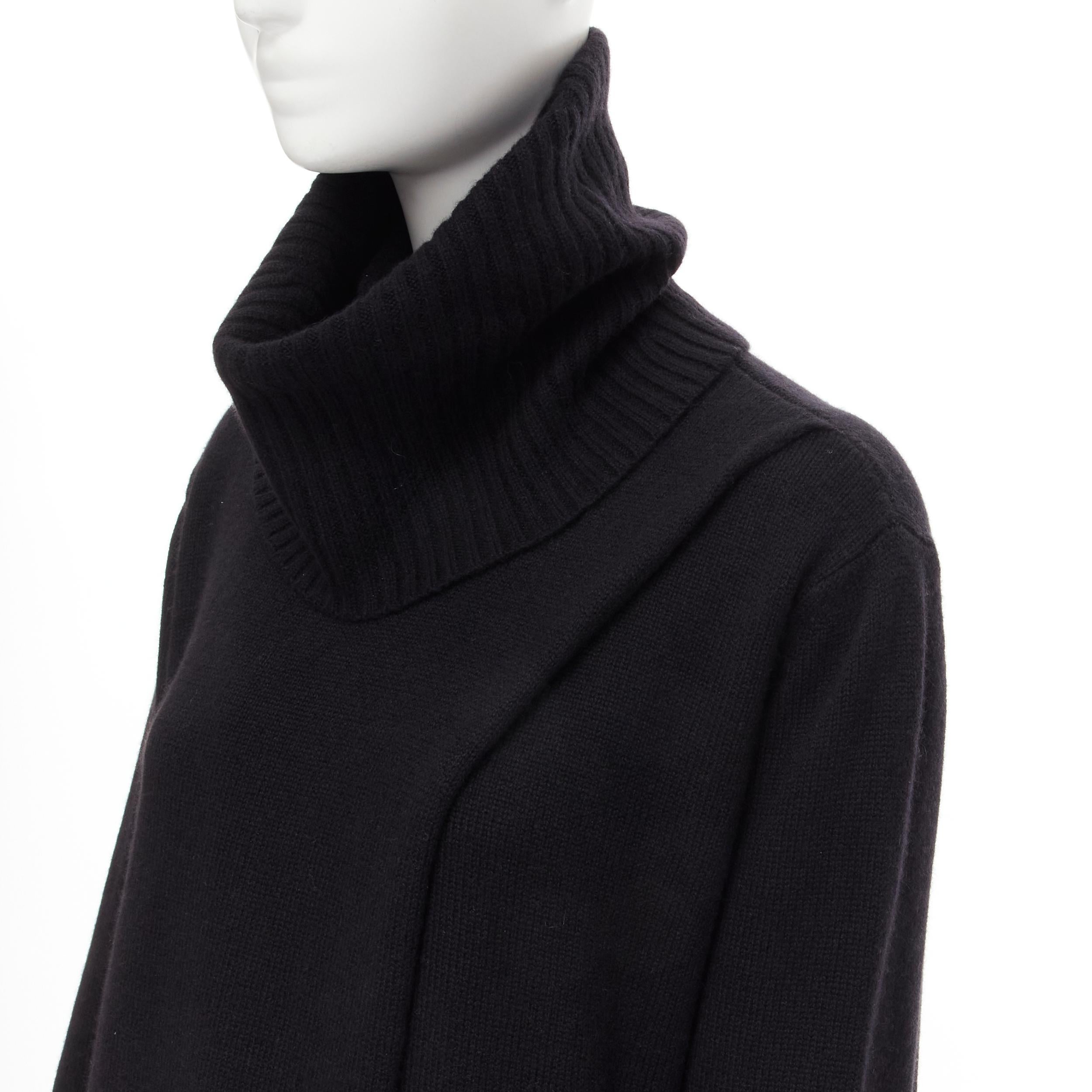 new THE ROW Kirsi 100% cashmere black split front turtleneck sweater tunic S 
Reference: MELK/A00101 
Brand: The Row 
Material: Cashmere 
Color: Black 
Pattern: Solid 
Extra Detail: Split front. 
Made in: USA 

CONDITION: 
Condition: New with tags.