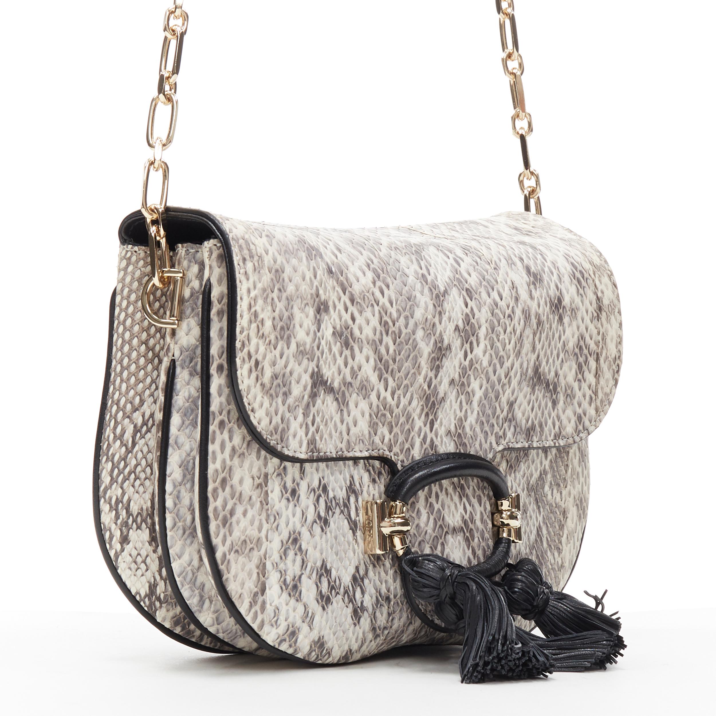 new TOD'S T-Ring Mini grey scaled leather black tassel gold chain crossbody bag
Brand: Tod's
Model Name / Style: Crossbody bag
Material: Leather
Color: Grey
Pattern: Solid
Extra Detail: Genuine leather. Black buckle detail. Tassel embellishment.
