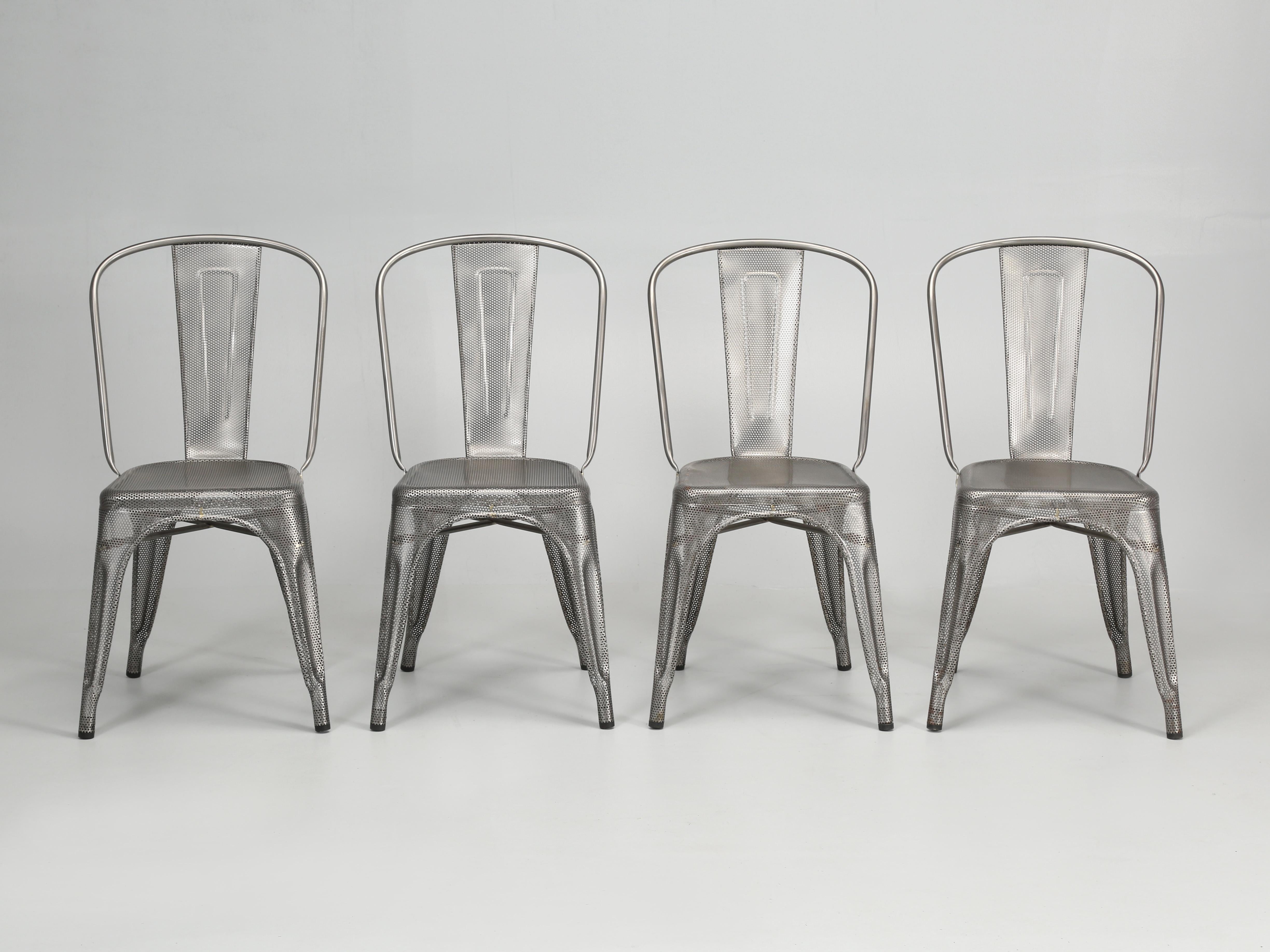 Genuine Hand-Made in France Tolix Wire Mesh steel stacking chairs, set of (4) available. These were showroom samples and then stored in a warehouse and are not flawless. Two chairs are in near perfect condition. One chair has light rust colored