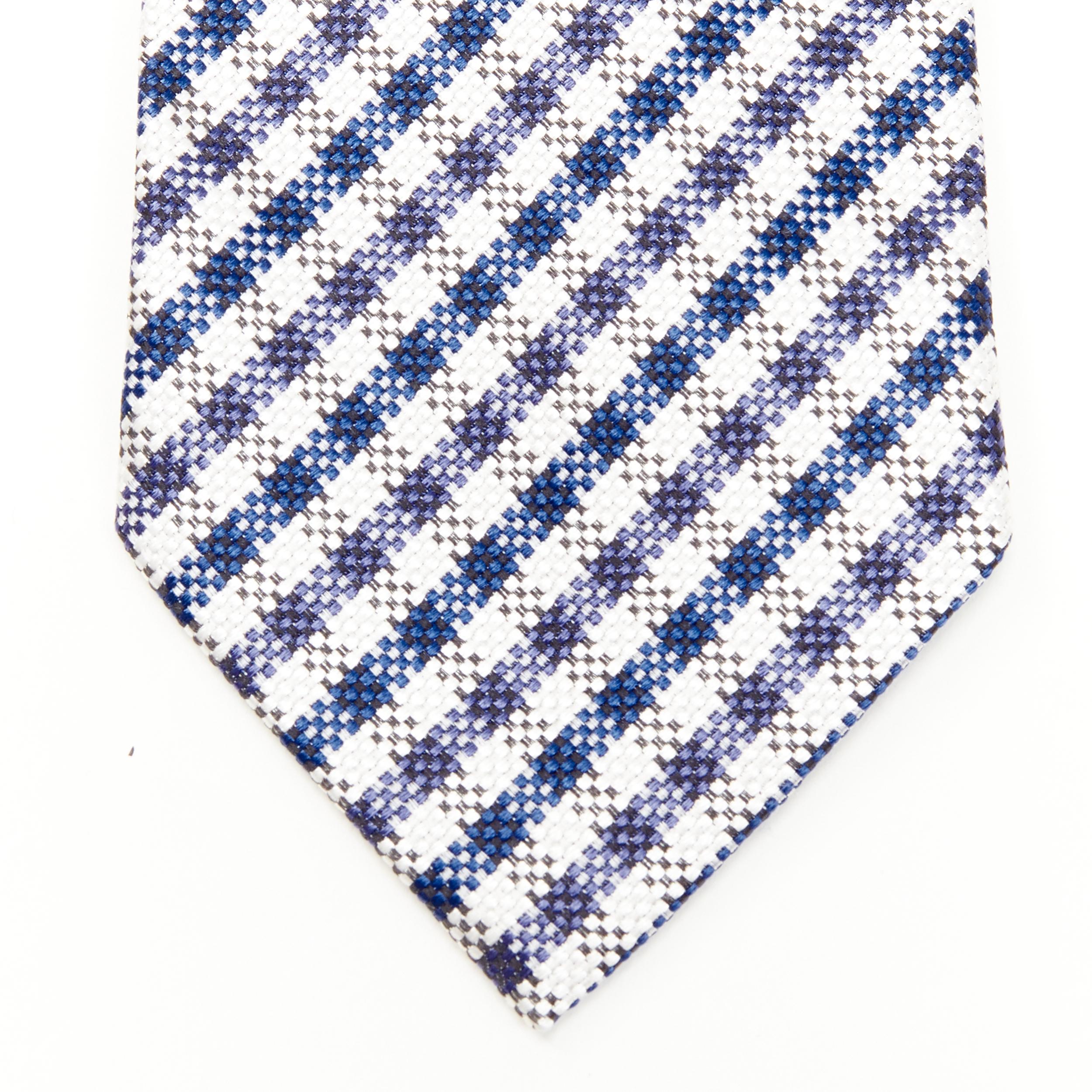 new TOM FORD 100% silk woven blue white checked tie 
Reference: JNWG/A00022 
Brand: Tom Ford 
Designer: Tom Ford 
Material: Silk 
Color: Blue 
Pattern: Check 
Estimated Retail Price: US $310 
Made in: Italy 

CONDITION: 
Condition: New with tags.