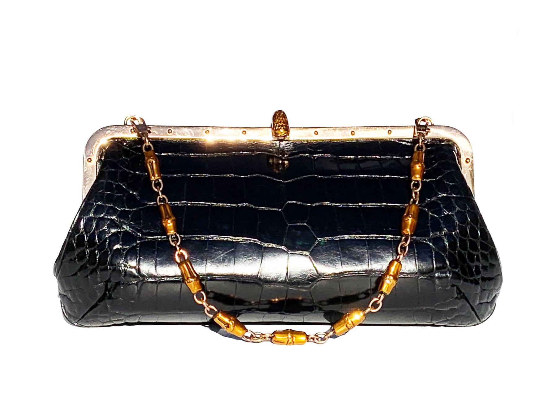 New Tom Ford for Gucci Limited Edition Black Crocodile Bag
S/S 2004 Collection
Crafted from crocodile skin, Bronze tone metal frame, Enamel clam closure finished with a large bronze tone enamel snake head with Swarovski crystals and clear crystal