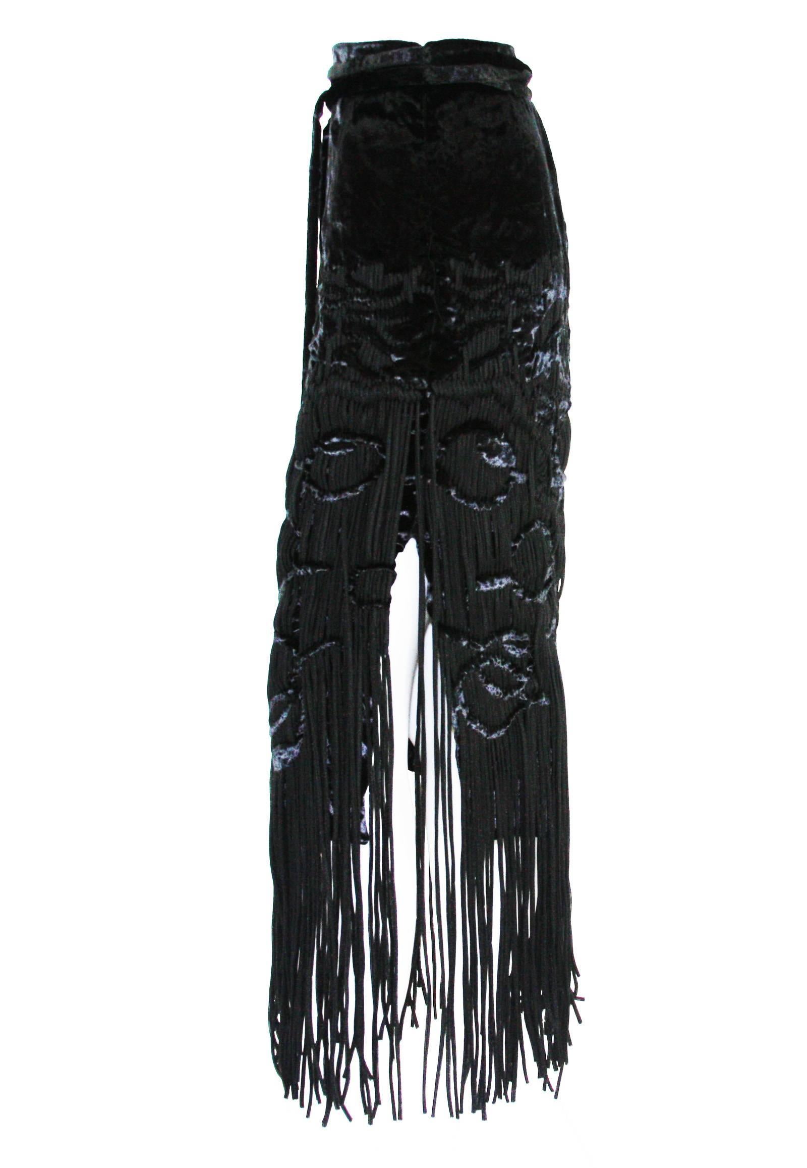 New Tom Ford for Yves Saint Lauren Velvet Fringe Silk Skirt
F/W 2001 Runway Collection
Fr. size 38 - US 6
The design of this skirt is extraordinary with the tassels being woven in and out of the crushed velvet.
The back includes an attached cinch
