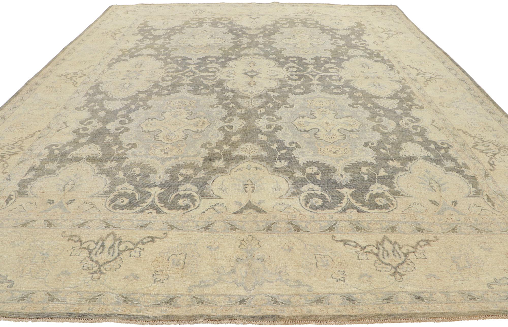 80940 New transitional area rug with modern style.
Serene and sophisticated, this hand knotted wool transitional rug beautifully embodies a modern style. The composition features an all-over botanical pattern composed of amorphous organic motifs