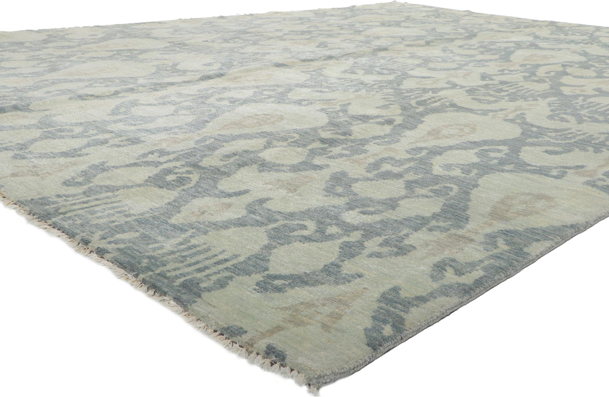 30255 New Transitional Ikat Rug, 10.00 X 13.08.
With its incredible detail and texture, this hand knotted wool Ikat rug from India is a captivating vision of woven beauty. The eye-catching ikat design and colorway woven into this piece work