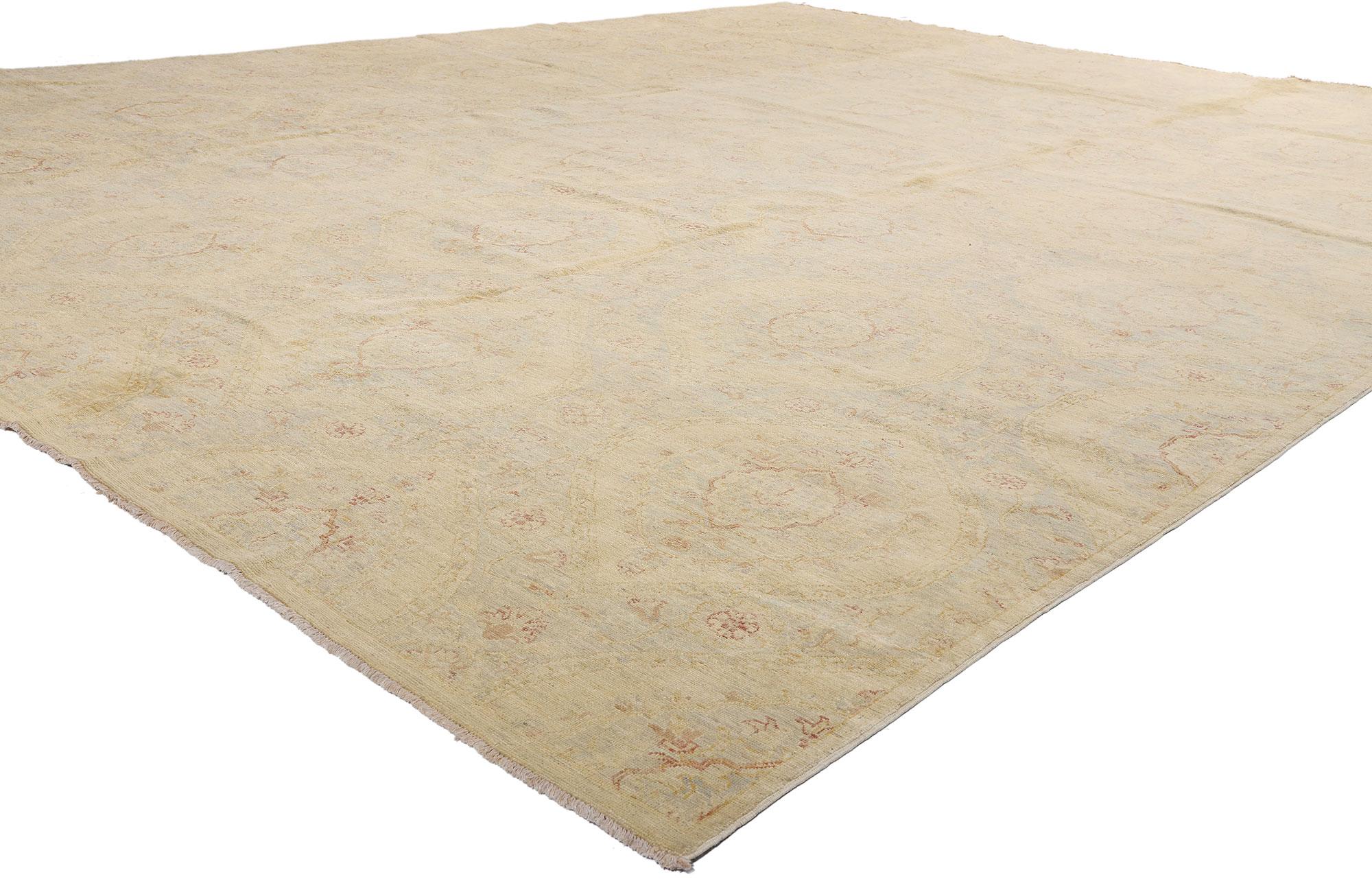 80177 New Transitional Area Rug, 12'05 x 15'06. Bathed in a soft, sun-washed palette that evokes the elegance of a faded heirloom, this hand-knotted wool transitional rug from Pakistan is a rarefied expression of quiet luxury. Its surface, a tableau