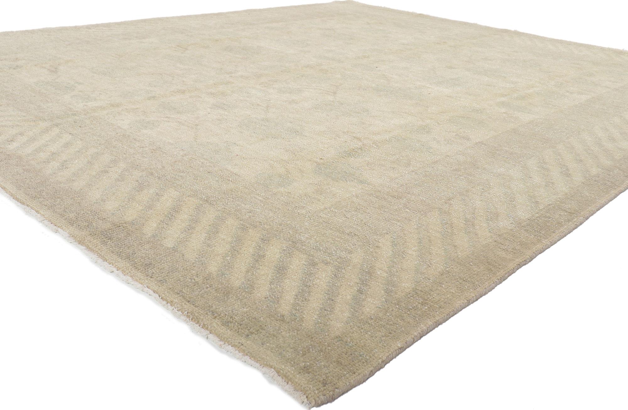 30096 New Vintage-Inspired Khotan Rug with Transitional Style, 08'01 x 09'09. Softer yet no less striking, this hand knotted wool vintage-inspired Khotan area rug showcases a transitional style. The pale muted color palette relaxes a repetitive