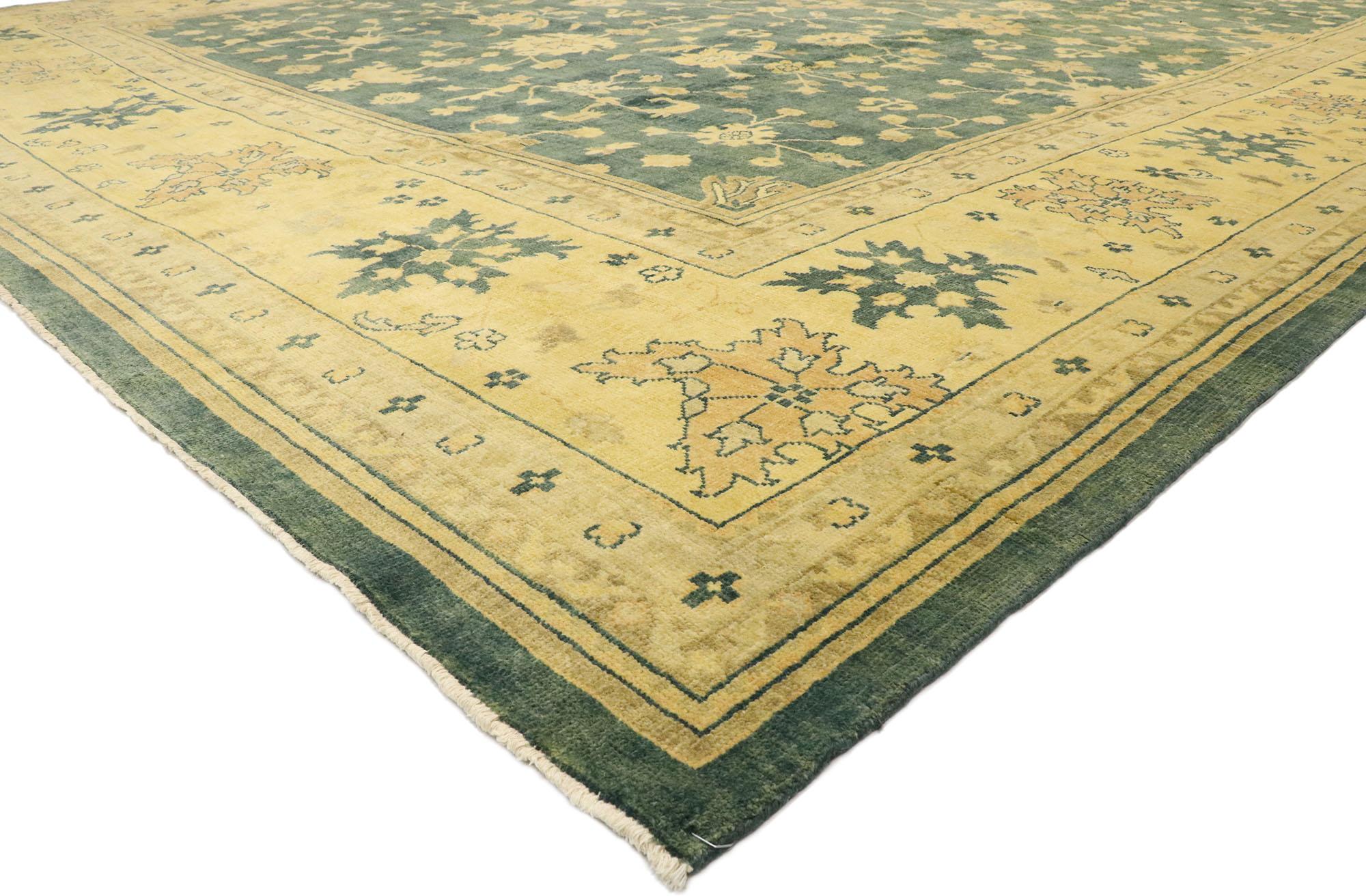 30181 New Transitional Oushak palace size rug with Hollywood Regency style. This hand knotted wool Oushak palace size rug features a Classic pattern composed of Harshang motifs, palmettes, stylized florals, and organic shapes. These spirited