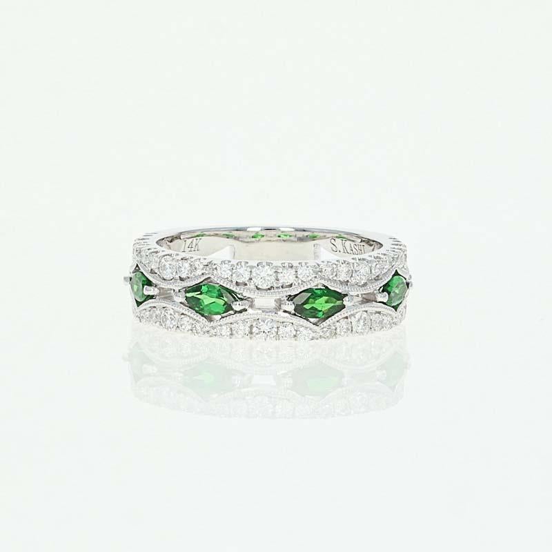 Color your world with this stunning NEW gemstone ring! Exquisitely crafted in 14k white gold, this band showcases a regal design graced by brilliant green Tsavorite garnets and sparkling white diamonds that are sweetly highlighted by milgrain