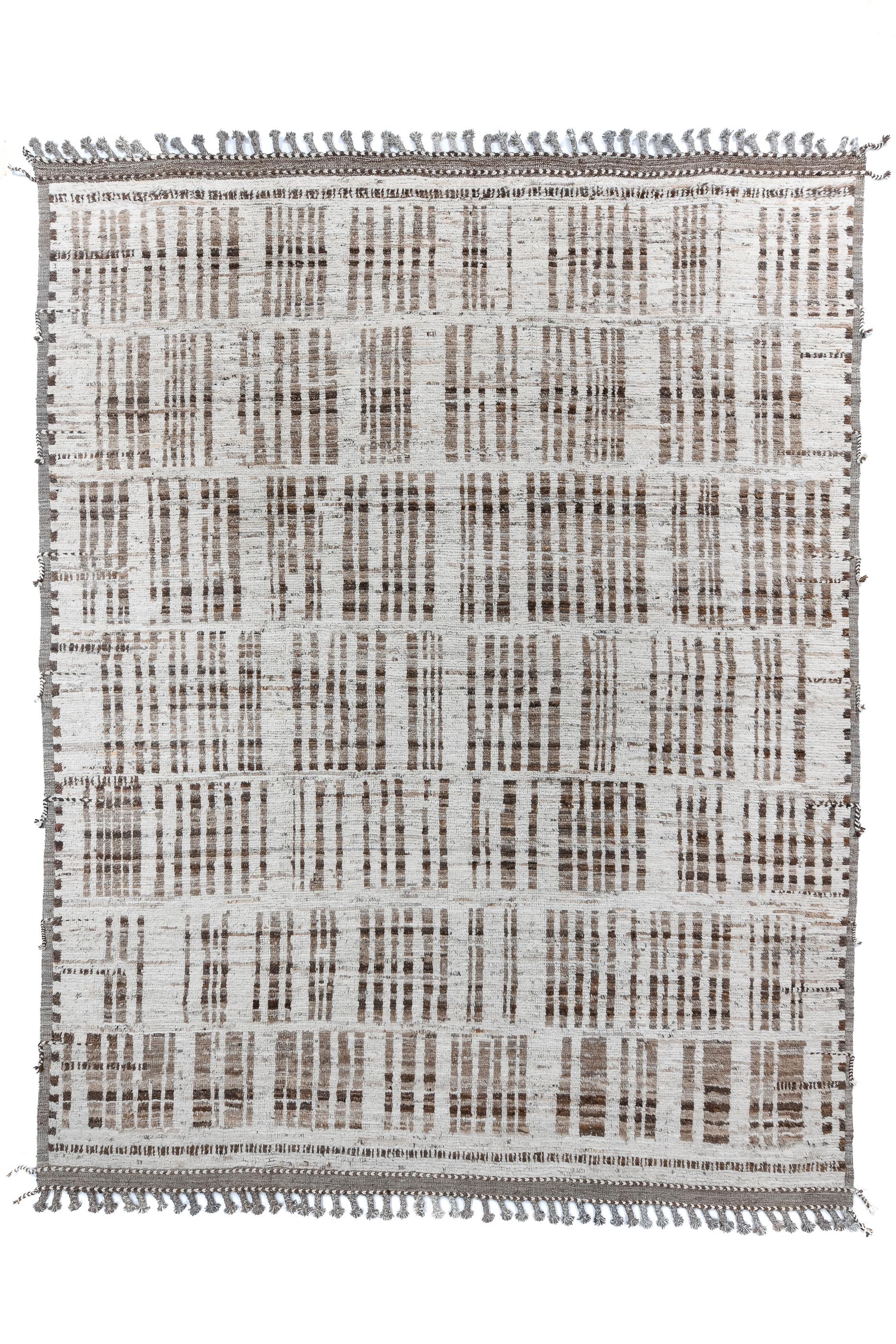 Seven rows of square bunches of parallel dark brown lines run across the sand field. The lines pinch up or stretch apart with no rhyme or reason. At each end is a flatwoven finishing strip with warp tassels.  No two squares/rectangles are alike.
