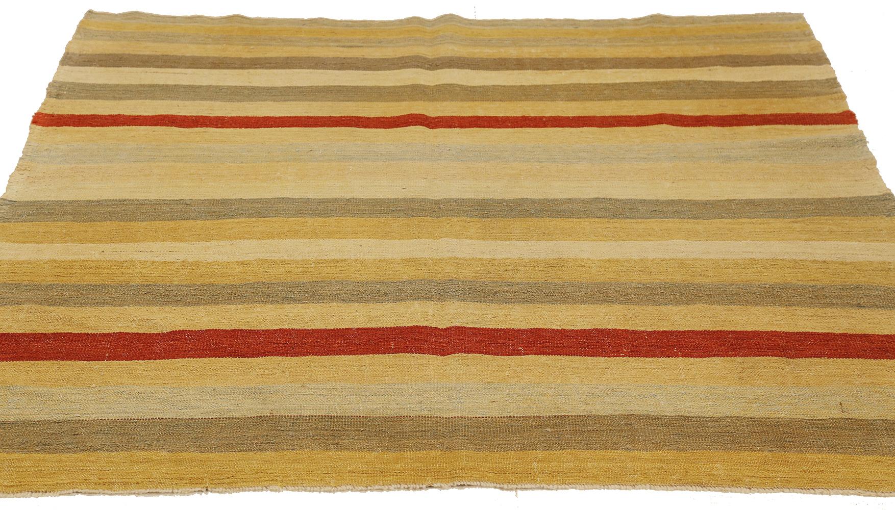 Persian rug handwoven from the finest sheep’s wool and colored with all-natural vegetable dyes that are safe for humans and pets. It’s a Kilim style flat-weave design featuring stripes in red, gray, and brown over an ivory field. It’s a stunning
