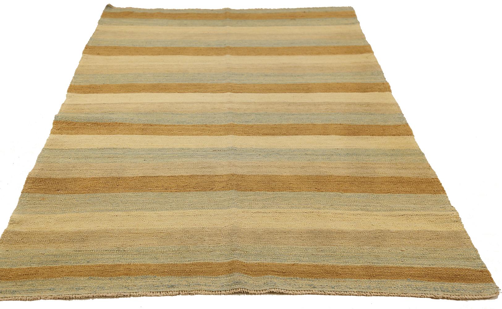 Persian rug handwoven from the finest sheep’s wool and colored with all-natural vegetable dyes that are safe for humans and pets. It’s a Kilim style flat-weave design featuring stripes in blue and brown over an ivory field. It’s a stunning piece to