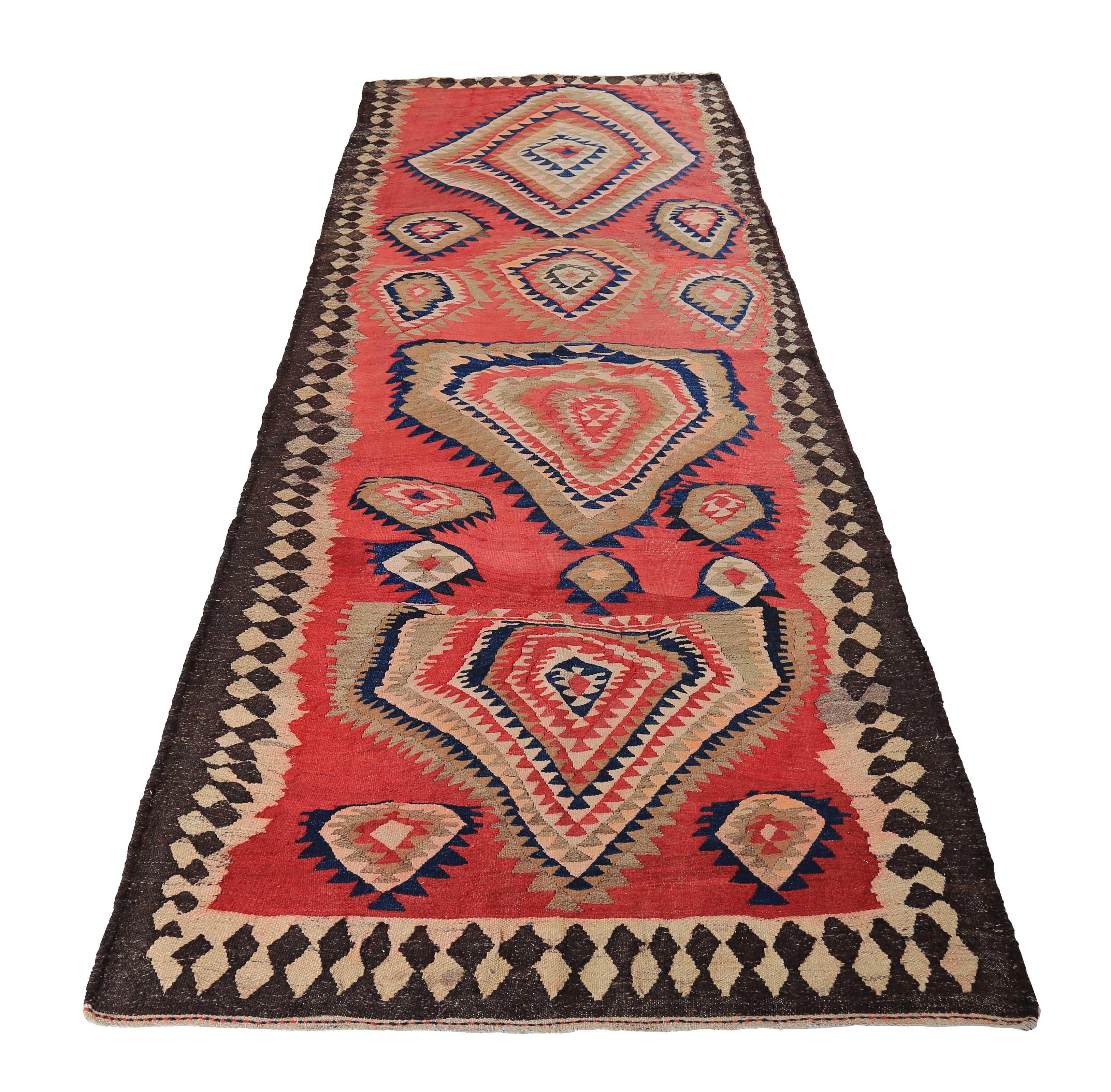 Turkish rug handwoven from the finest sheep’s wool and colored with all-natural vegetable dyes that are safe for humans and pets. It’s a traditional Kilim flat-weave design featuring a tribal design field with beige and navy medallions. It’s a