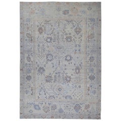 New Turkish Oushak Rug with Blue and Brown Floral Details on Ivory Field