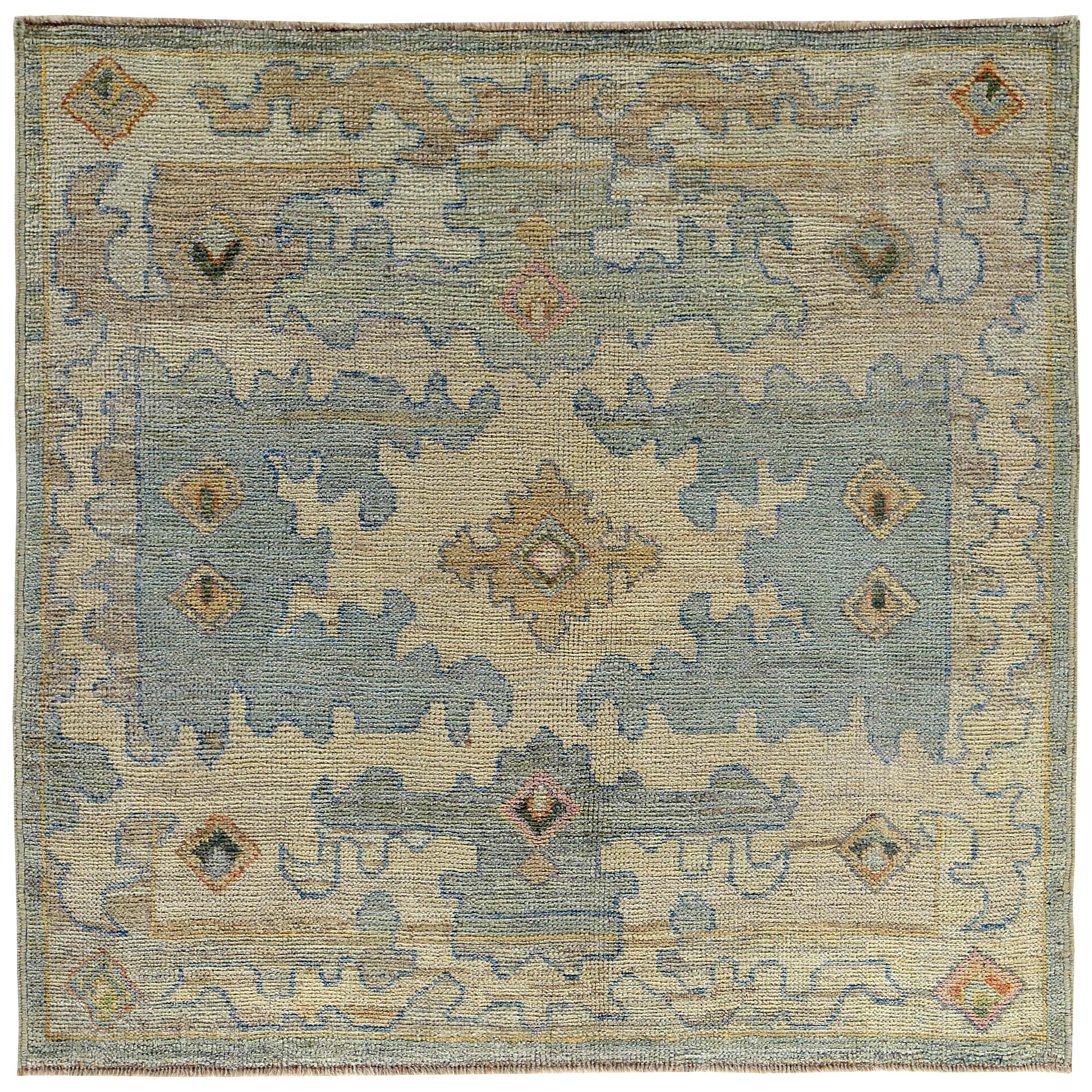 New Turkish Oushak Rug with Blue and Green Floral Details on Beige Field For Sale