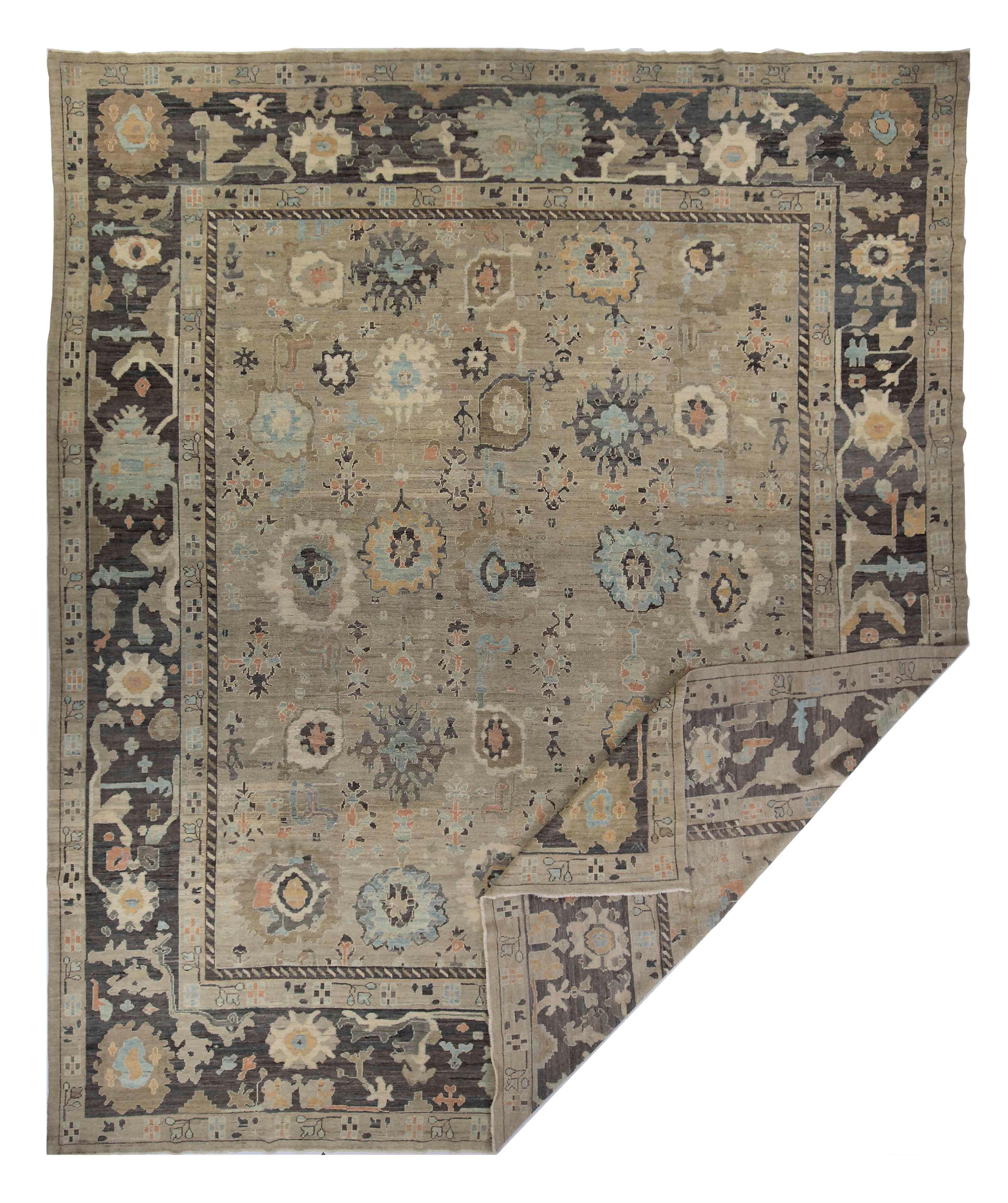 New Turkish rug made of handwoven sheep’s wool of the finest quality. It’s colored with organic vegetable dyes that are certified safe for humans and pets alike. It features floral details in pink and blue over a regal gray field. Flower patterns