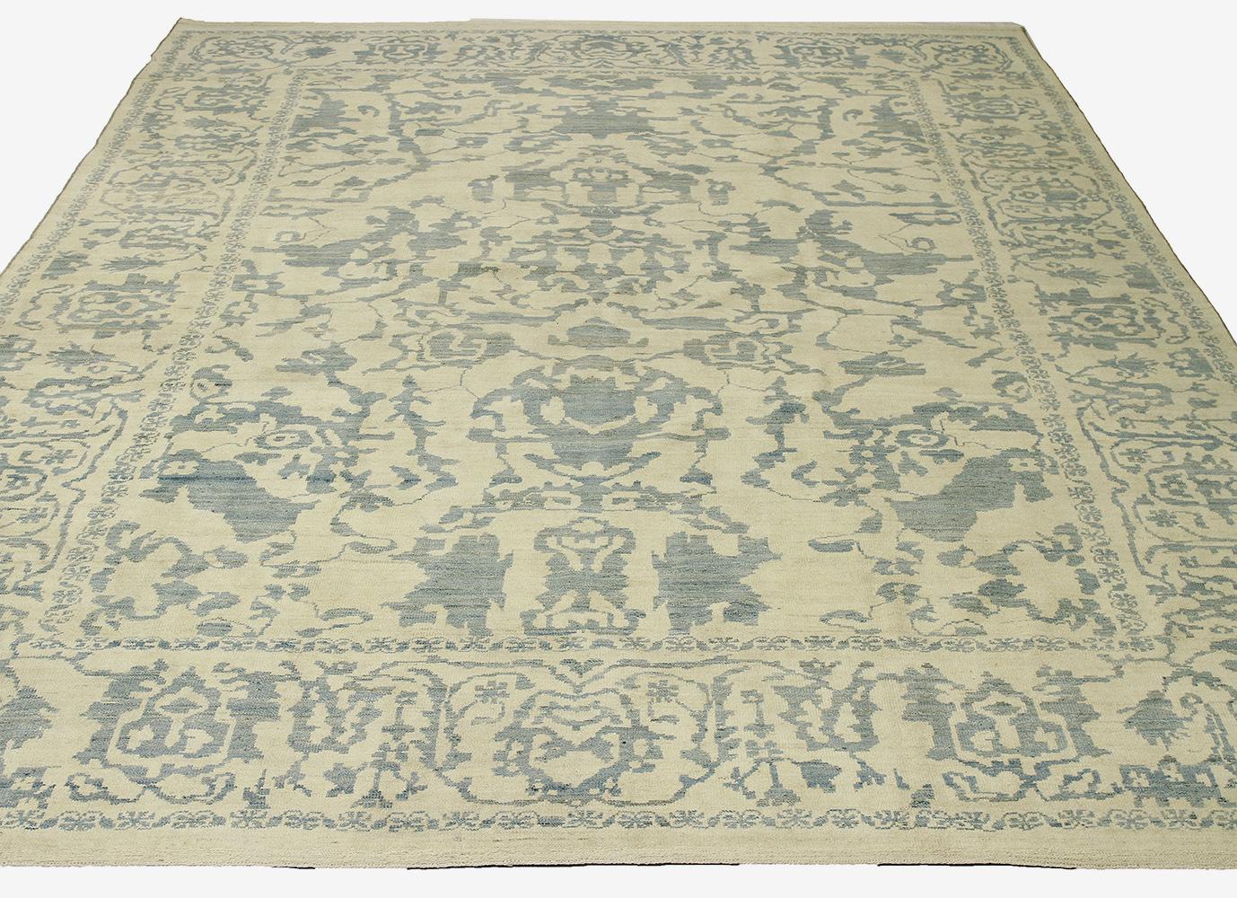 New Turkish rug made of handwoven sheep’s wool of the finest quality. It’s colored with organic vegetable dyes that are certified safe for humans and pets alike. It features flower details allover associated with Oushak weaving from ancient Anatolia