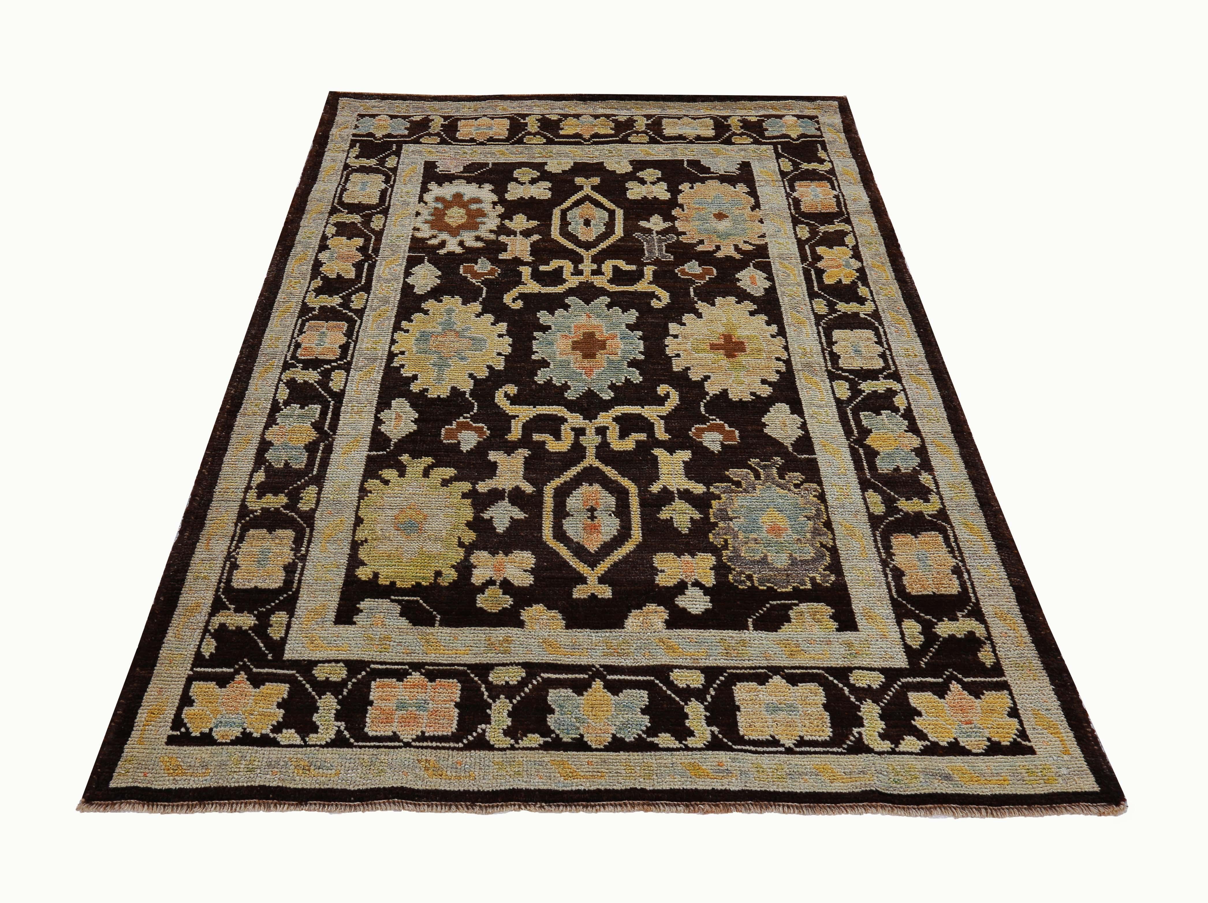 New Turkish rug made of handwoven sheep’s wool of the finest quality. It’s colored with organic vegetable dyes that are certified safe for humans and pets alike. It features floral details in blue, yellow and green over a brown field. Flower