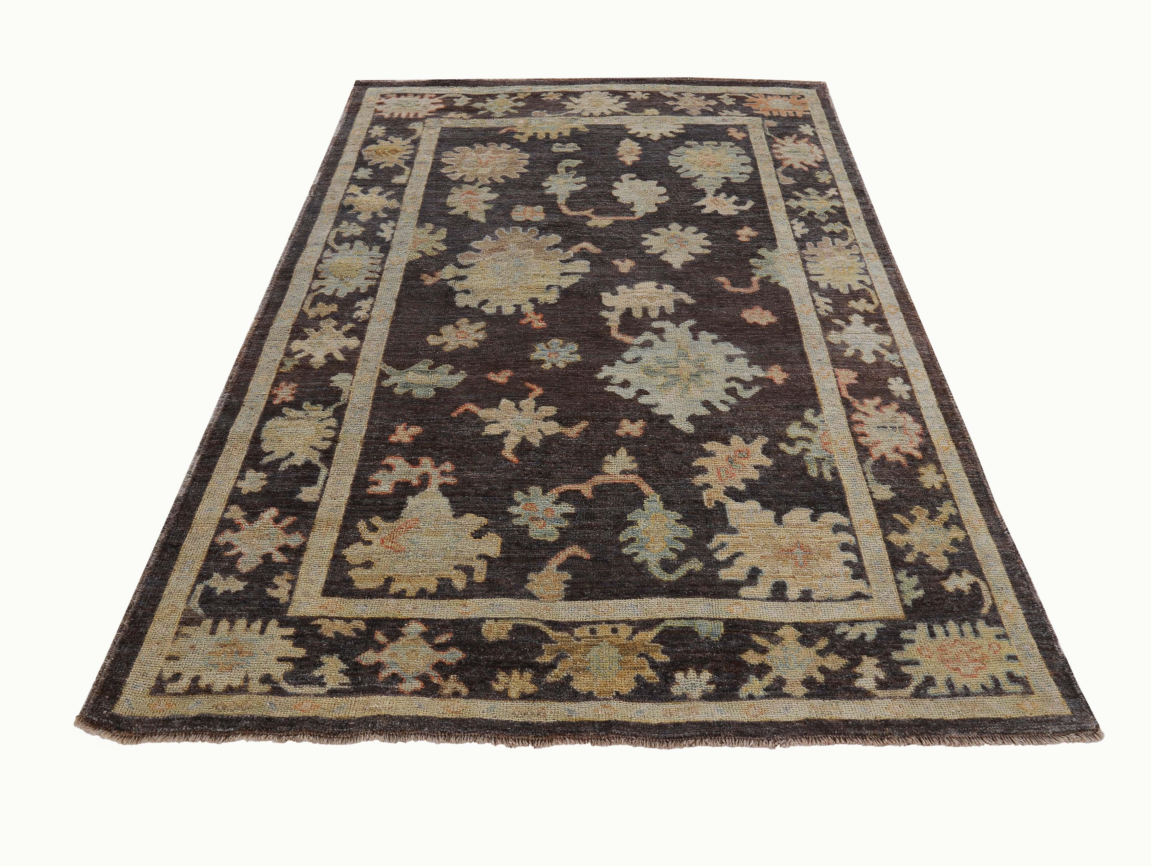New Turkish rug made of handwoven sheep’s wool of the finest quality. It’s colored with organic vegetable dyes that are certified safe for humans and pets alike. It features floral details in brown, yellow and blue over a blue field. Flower patterns
