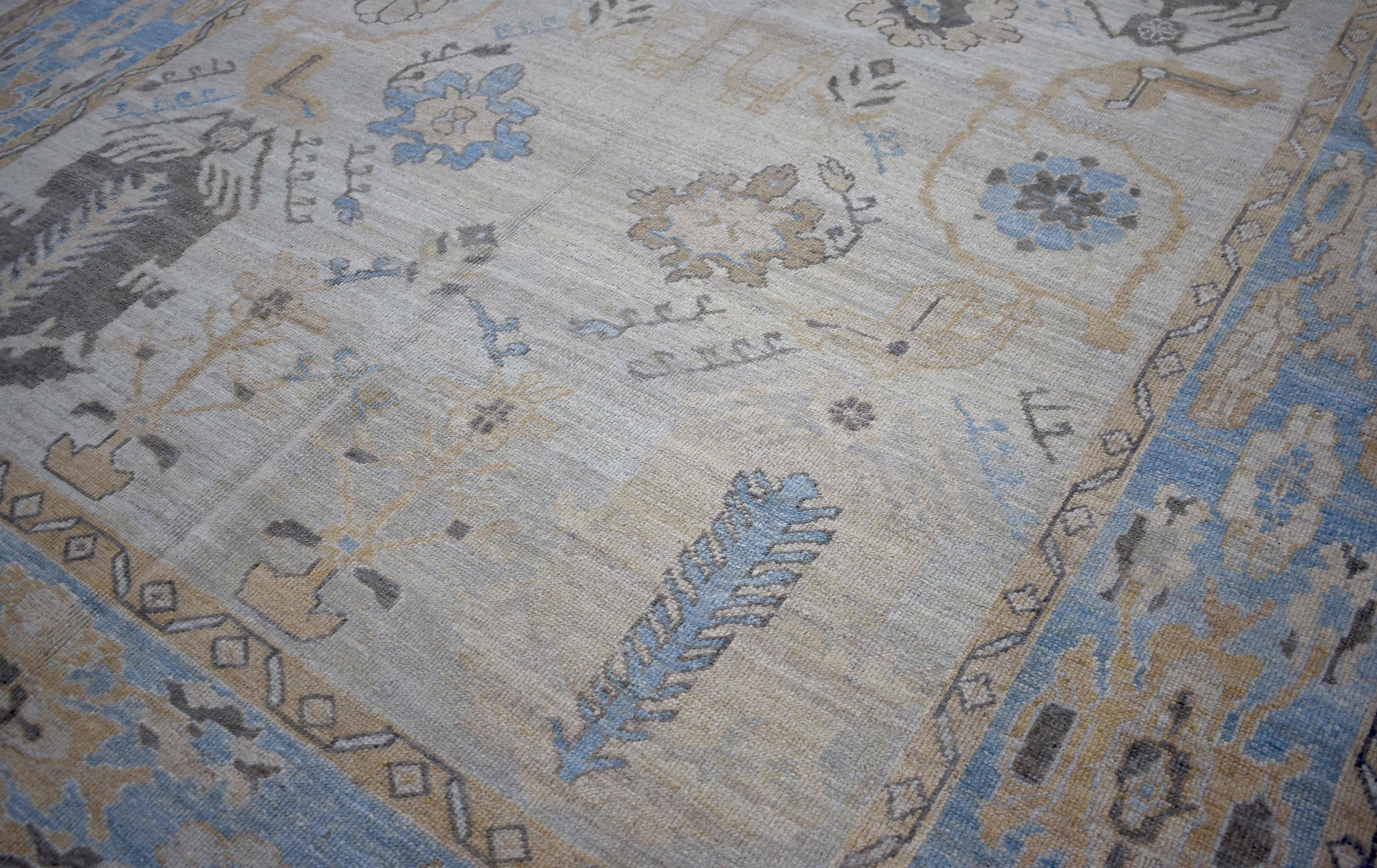 Hand-Woven New Turkish Oushak Rug with Gray and Beige Floral Patterns on Blue Field For Sale