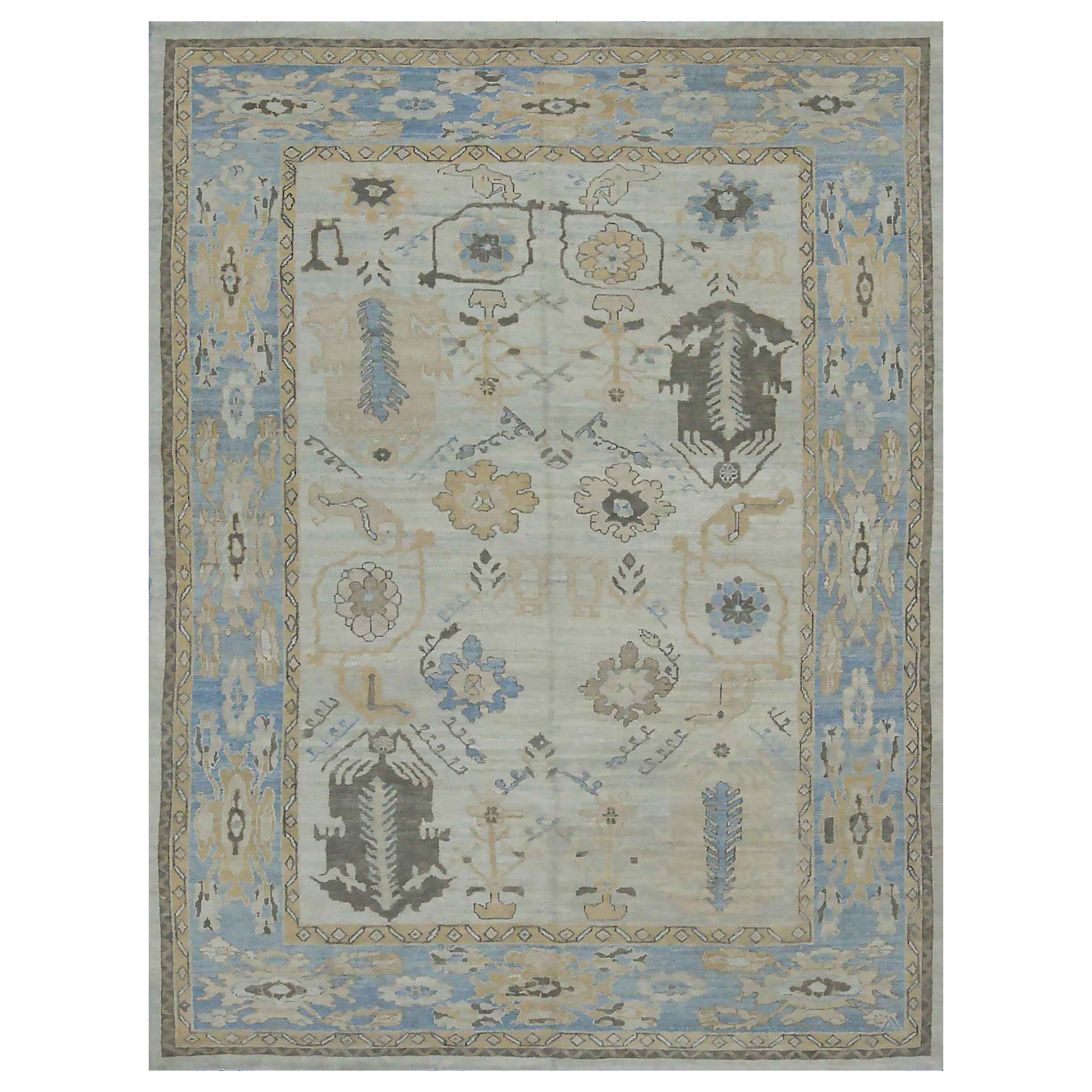 New Turkish Oushak Rug with Gray and Beige Floral Patterns on Blue Field For Sale