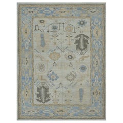 New Turkish Oushak Rug with Gray and Beige Floral Patterns on Blue Field