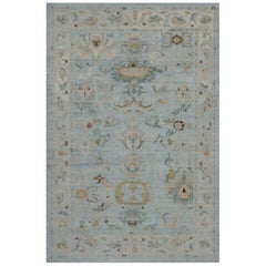 New Turkish Oushak Rug with Green and Beige Floral Details on Blue Field