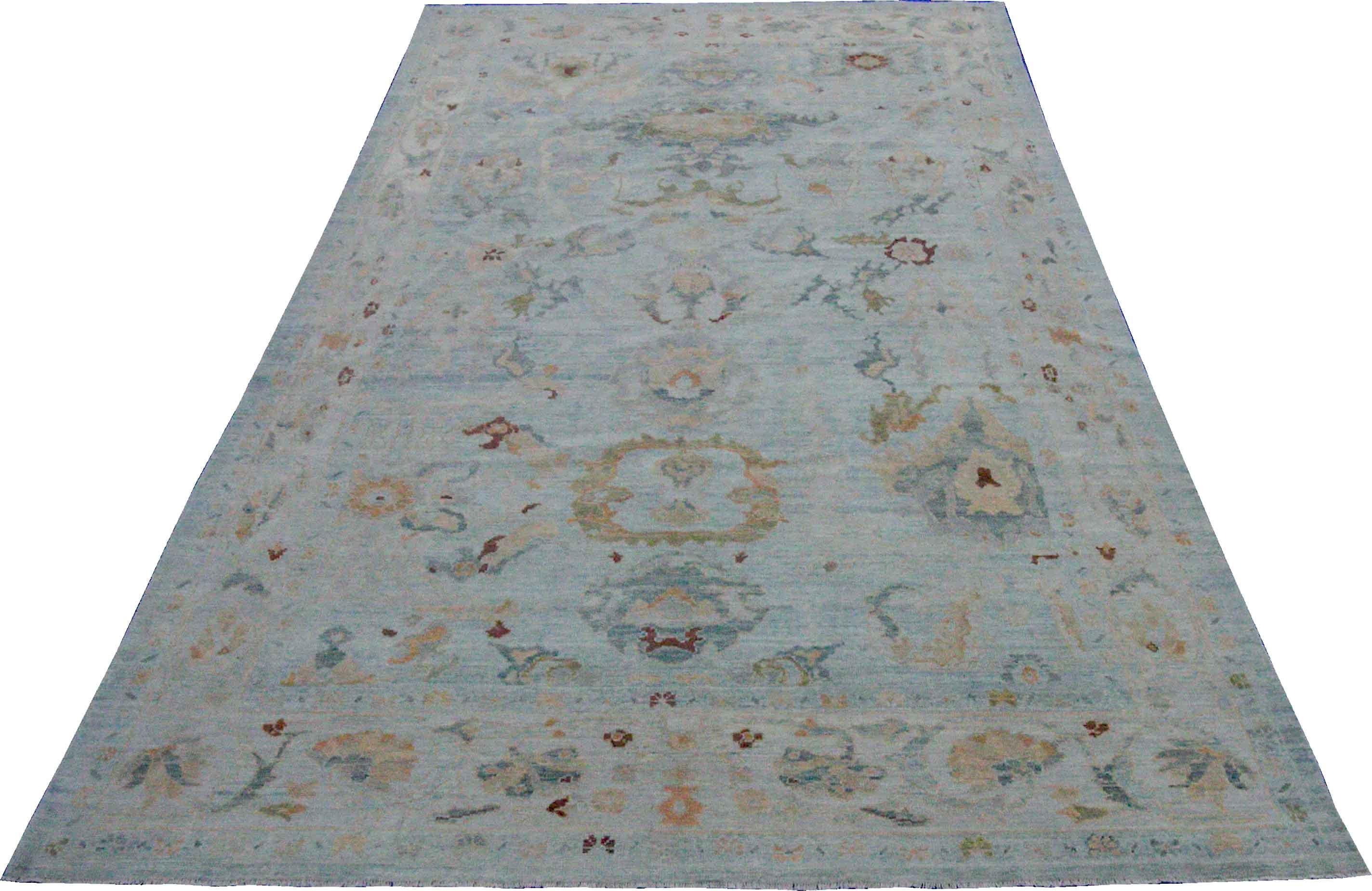 New Turkish rug made of handwoven sheep’s wool of the finest quality. It’s colored with organic vegetable dyes that are certified safe for humans and pets alike. It features floral details in green and beige over a blue field. Flower patterns are