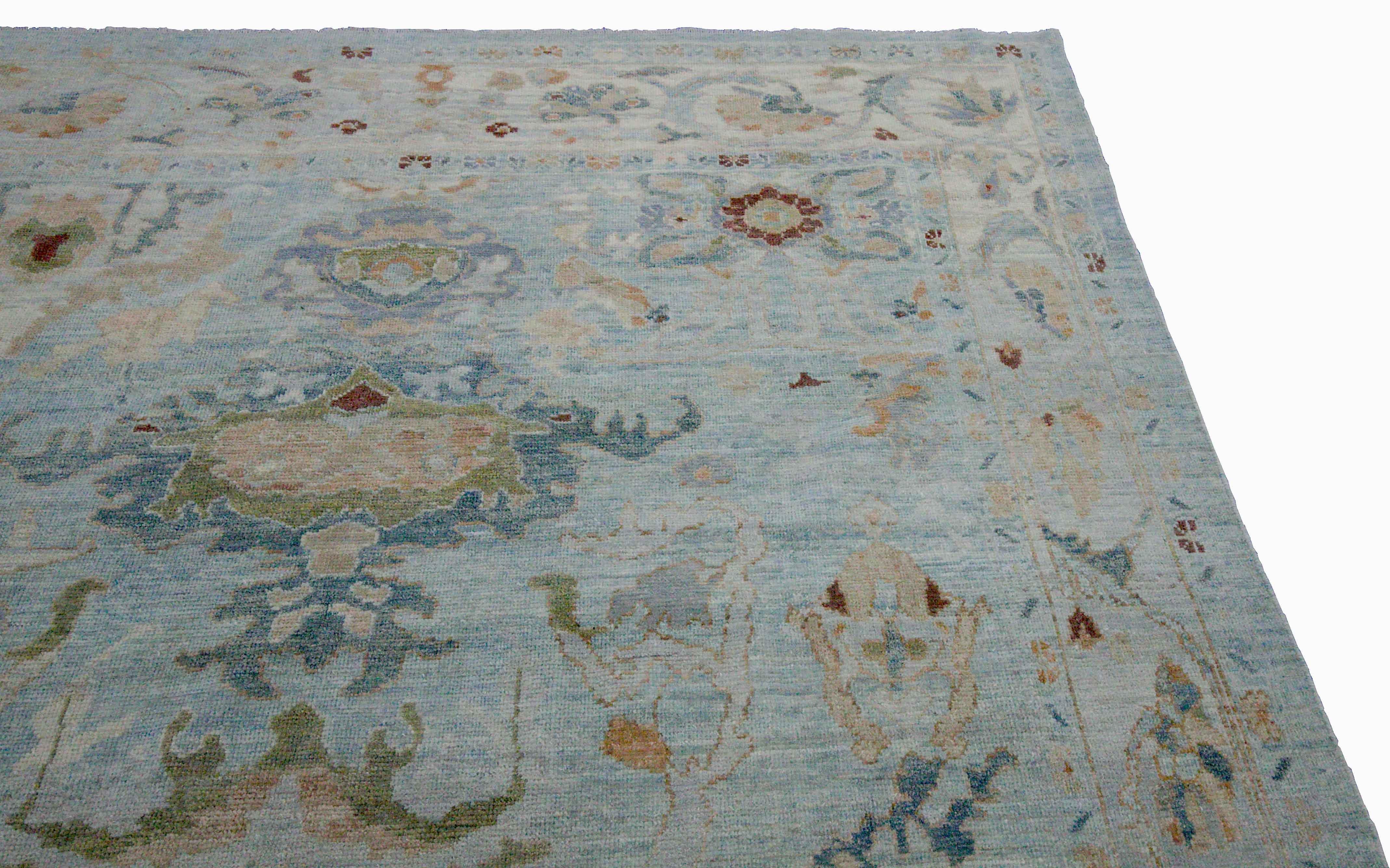 Contemporary New Turkish Oushak Rug with Green and Beige Floral Details on Blue Field For Sale