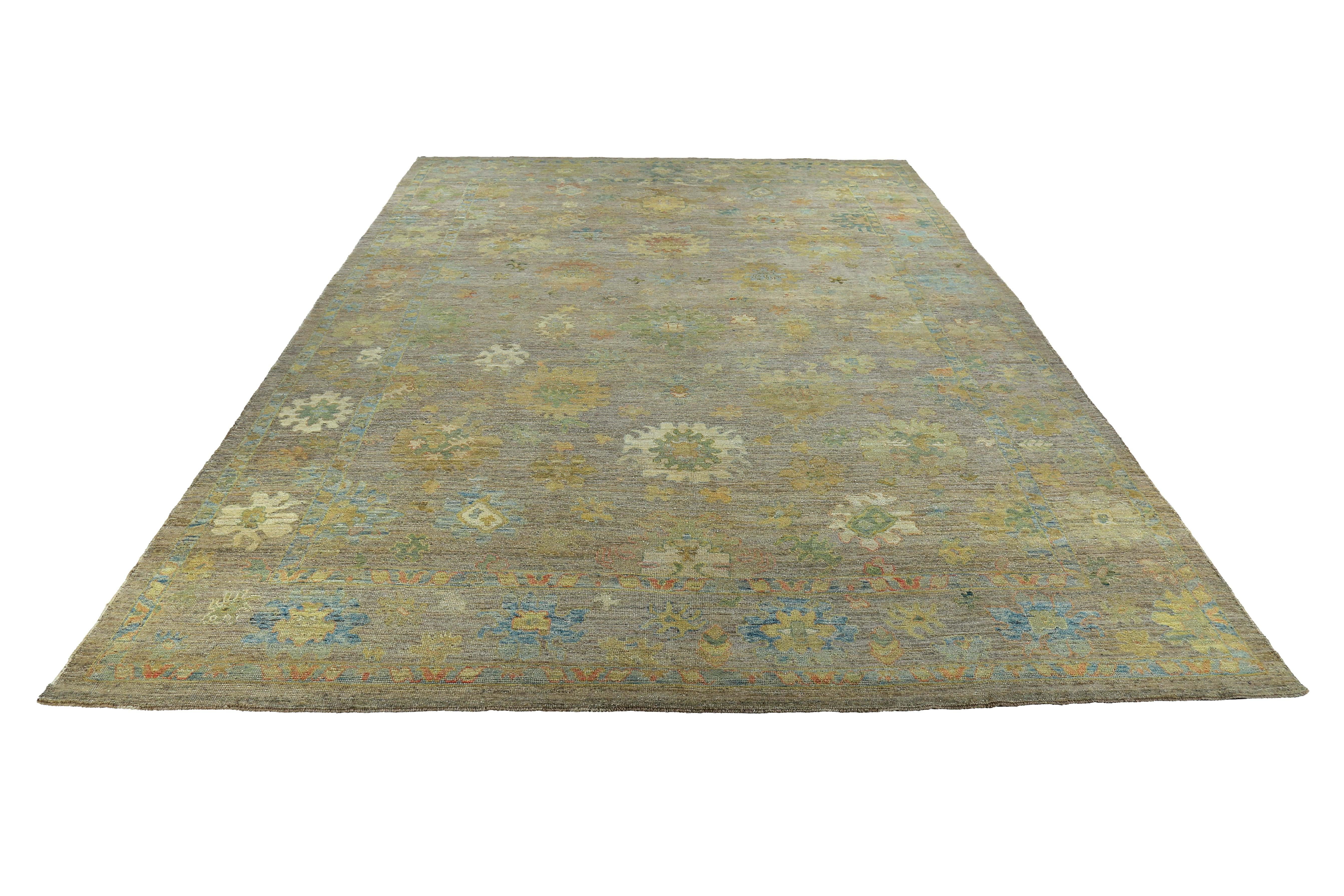 New Turkish rug made of handwoven sheep’s wool of the finest quality. It’s colored with organic vegetable dyes that are certified safe for humans and pets alike. It features floral design in green and yellow over a brown field. Flower patterns are