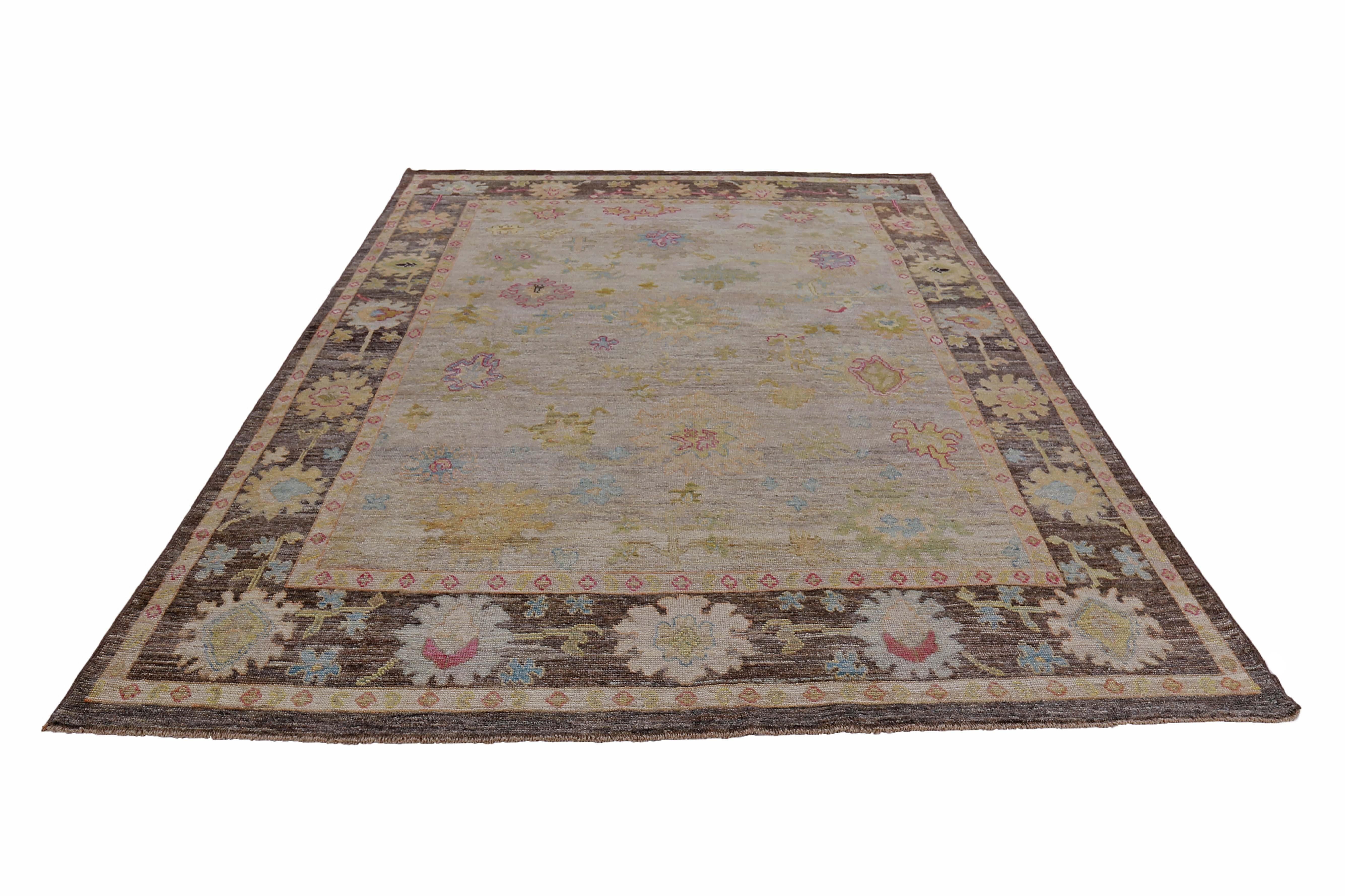 New Turkish rug made of handwoven sheep’s wool of the finest quality. It’s colored with organic vegetable dyes that are certified safe for humans and pets alike. It features floral design in green and yellow over a brown field. Flower patterns are