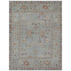 Nouveau tapis turc Oushak avec détails floraux ivoire et rouges sur fond bleu