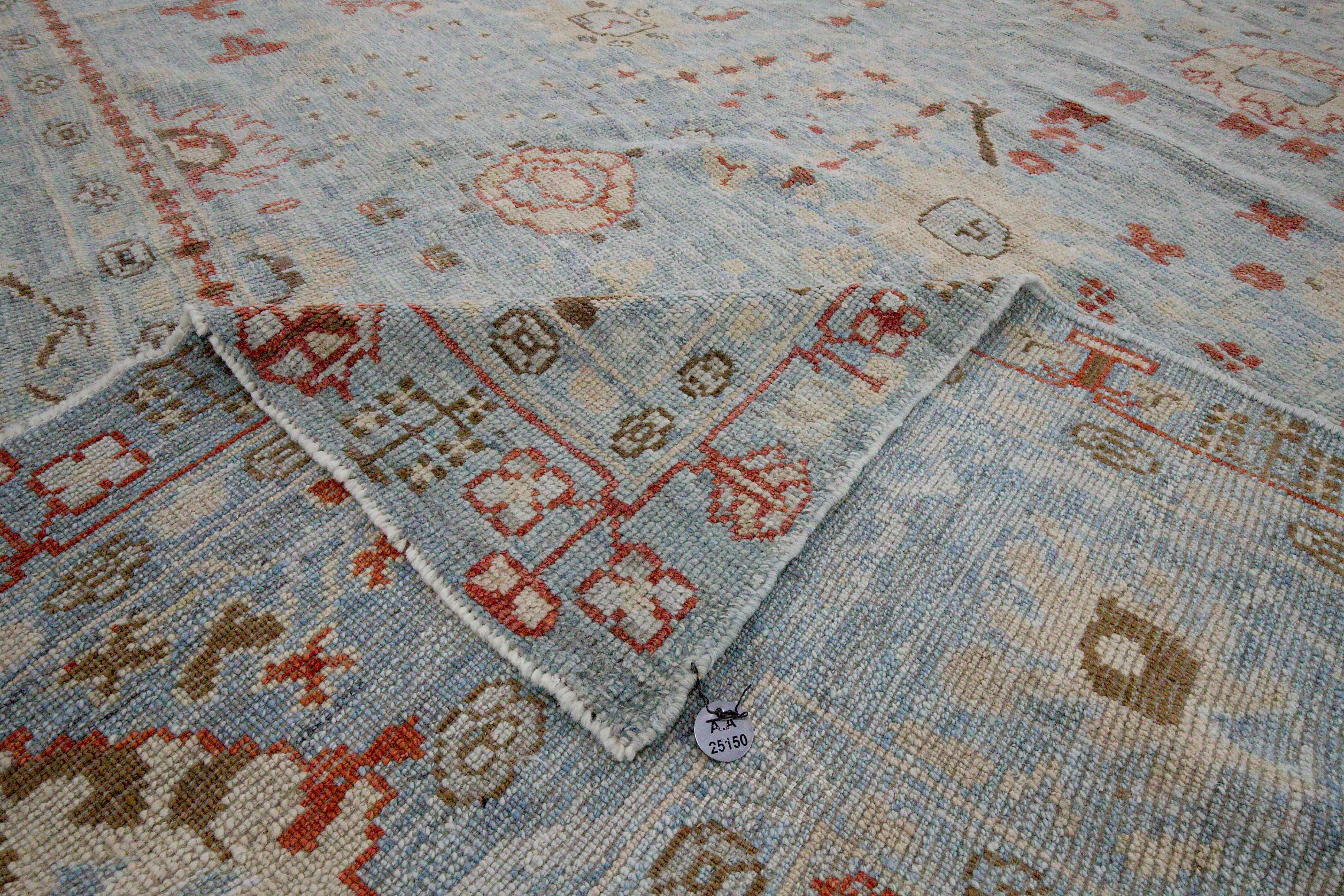 Wool New Turkish Oushak Rug with Ivory and Red Floral Details on Blue Field For Sale