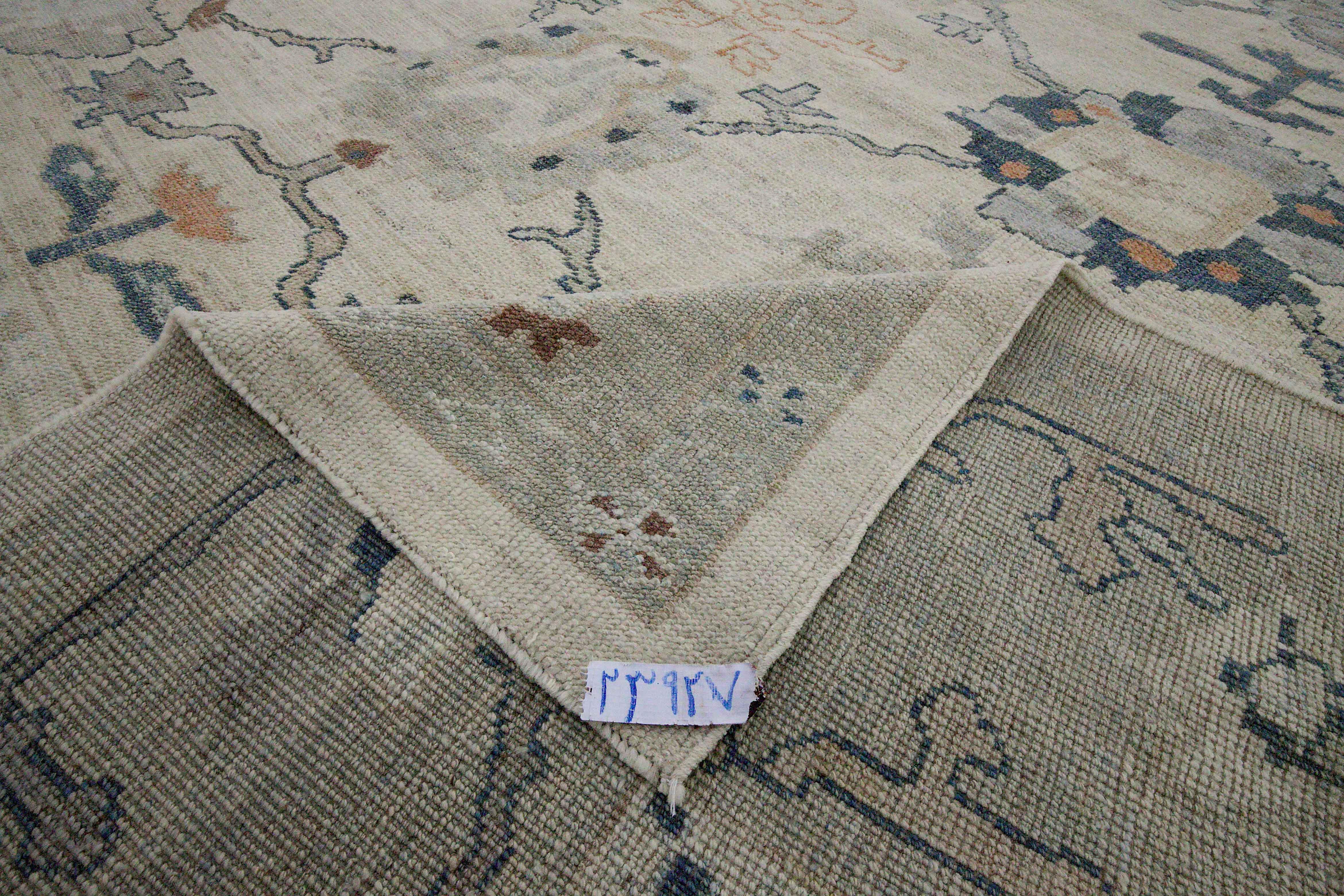 Contemporary New Turkish Oushak Rug with Navy Blue and Gray Floral Details on Ivory Field For Sale