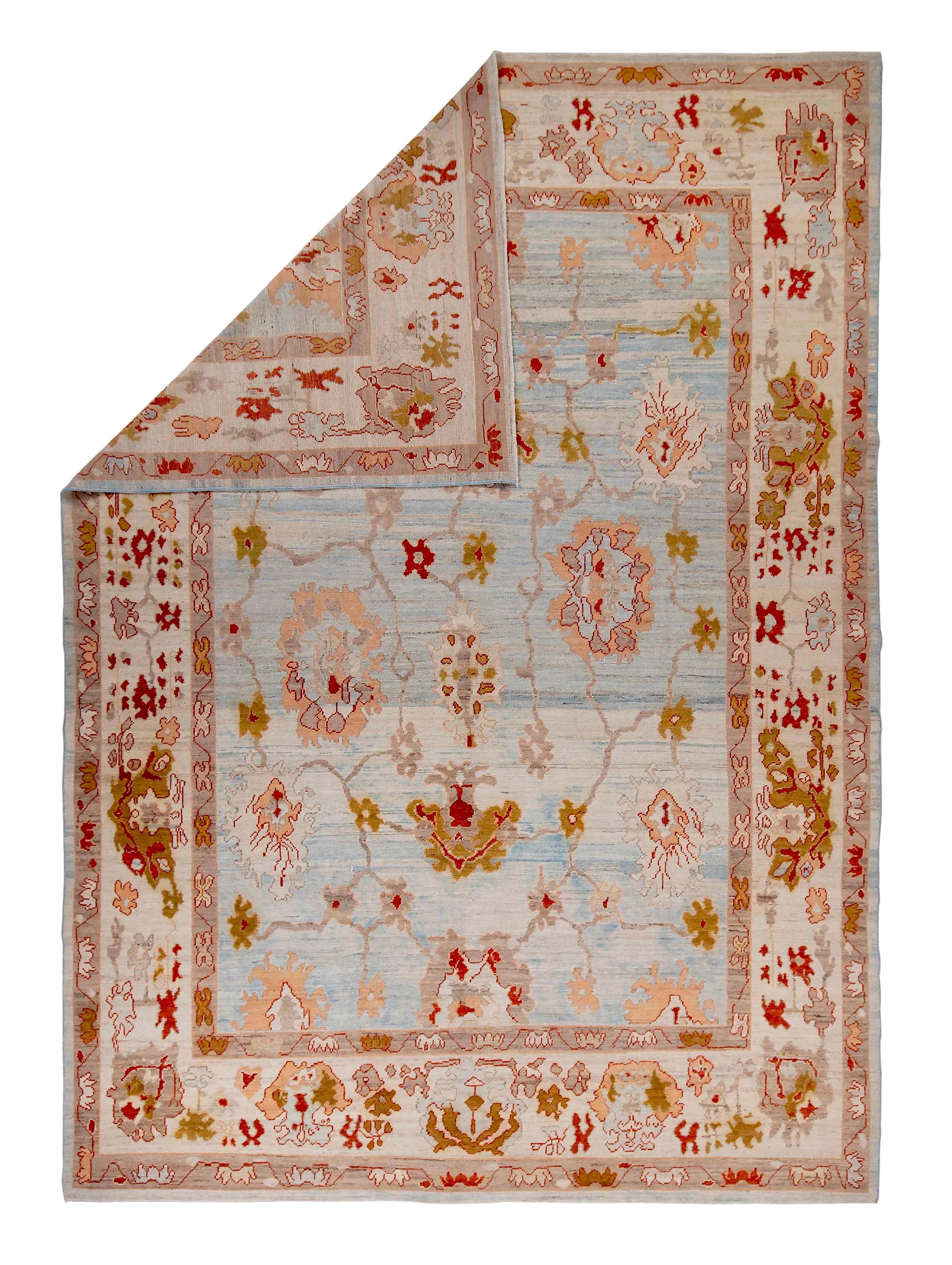 Wool New Turkish Oushak Rug with Red & Brown Floral Details on Blue & Ivory Field For Sale