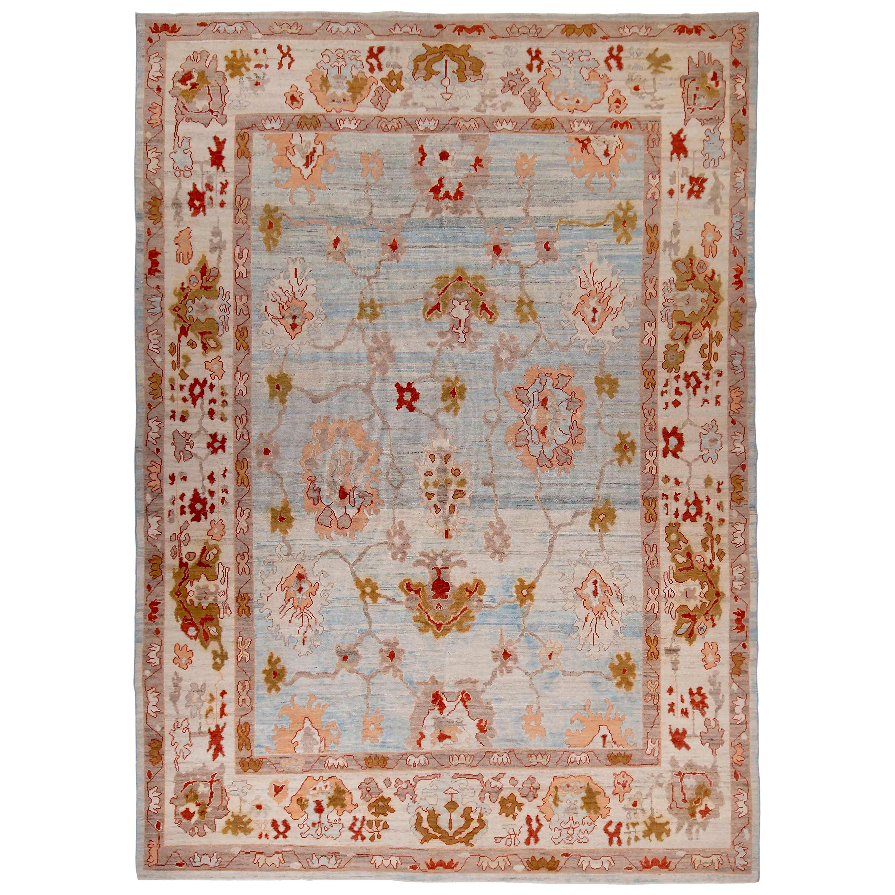 New Turkish Oushak Rug with Red & Brown Floral Details on Blue & Ivory Field For Sale