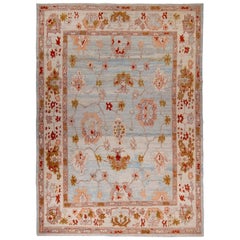 New Turkish Oushak Rug with Red & Brown Floral Details on Blue & Ivory Field