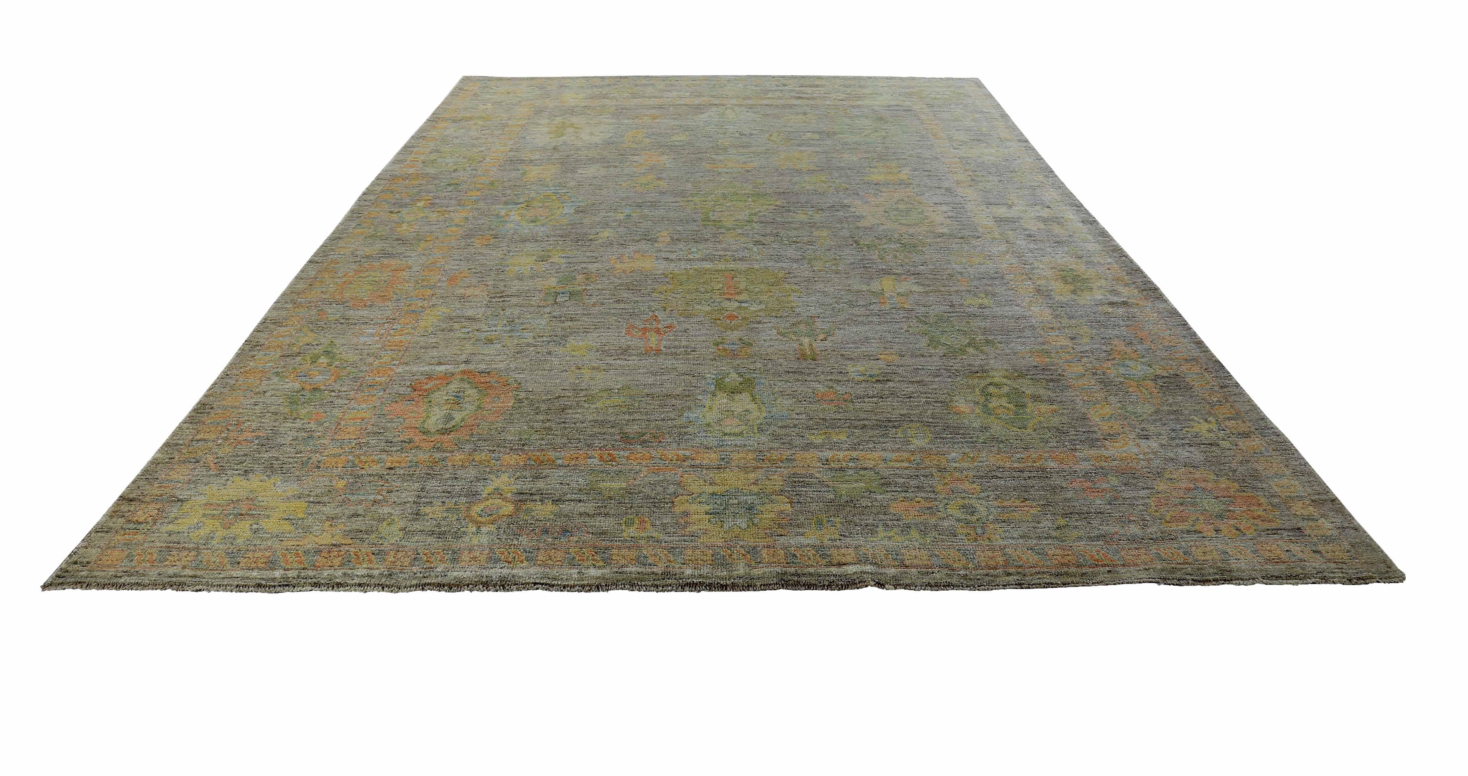 New Turkish rug made of handwoven sheep’s wool of the finest quality. It’s colored with organic vegetable dyes that are certified safe for humans and pets alike. It features yellow and green floral details on an elegant brown field. Flower patterns
