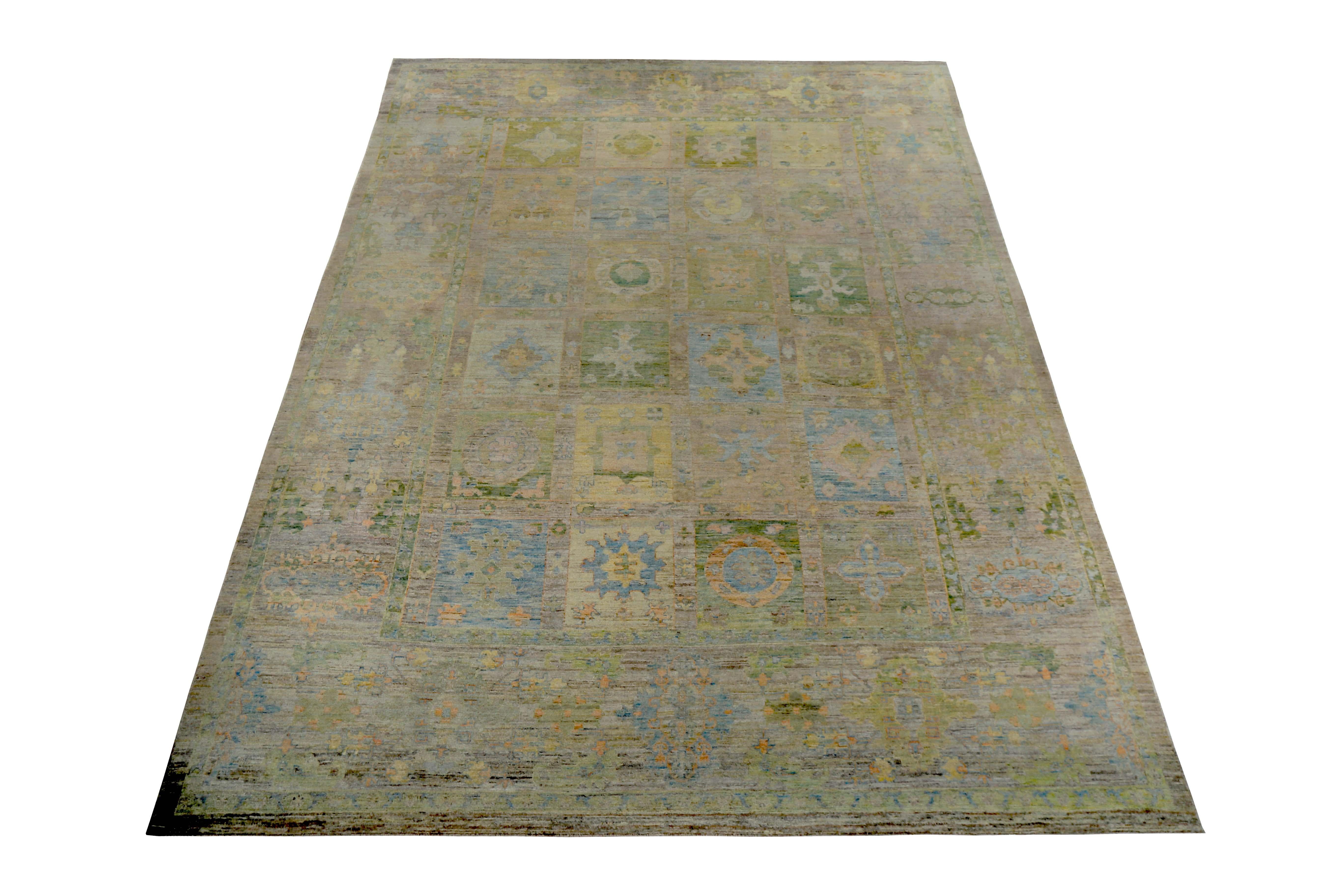 New Turkish rug made of handwoven sheep’s wool of the finest quality. It’s colored with organic vegetable dyes that are certified safe for humans and pets alike. It features floral blocks in blue and green over a brown field. Flower patterns are