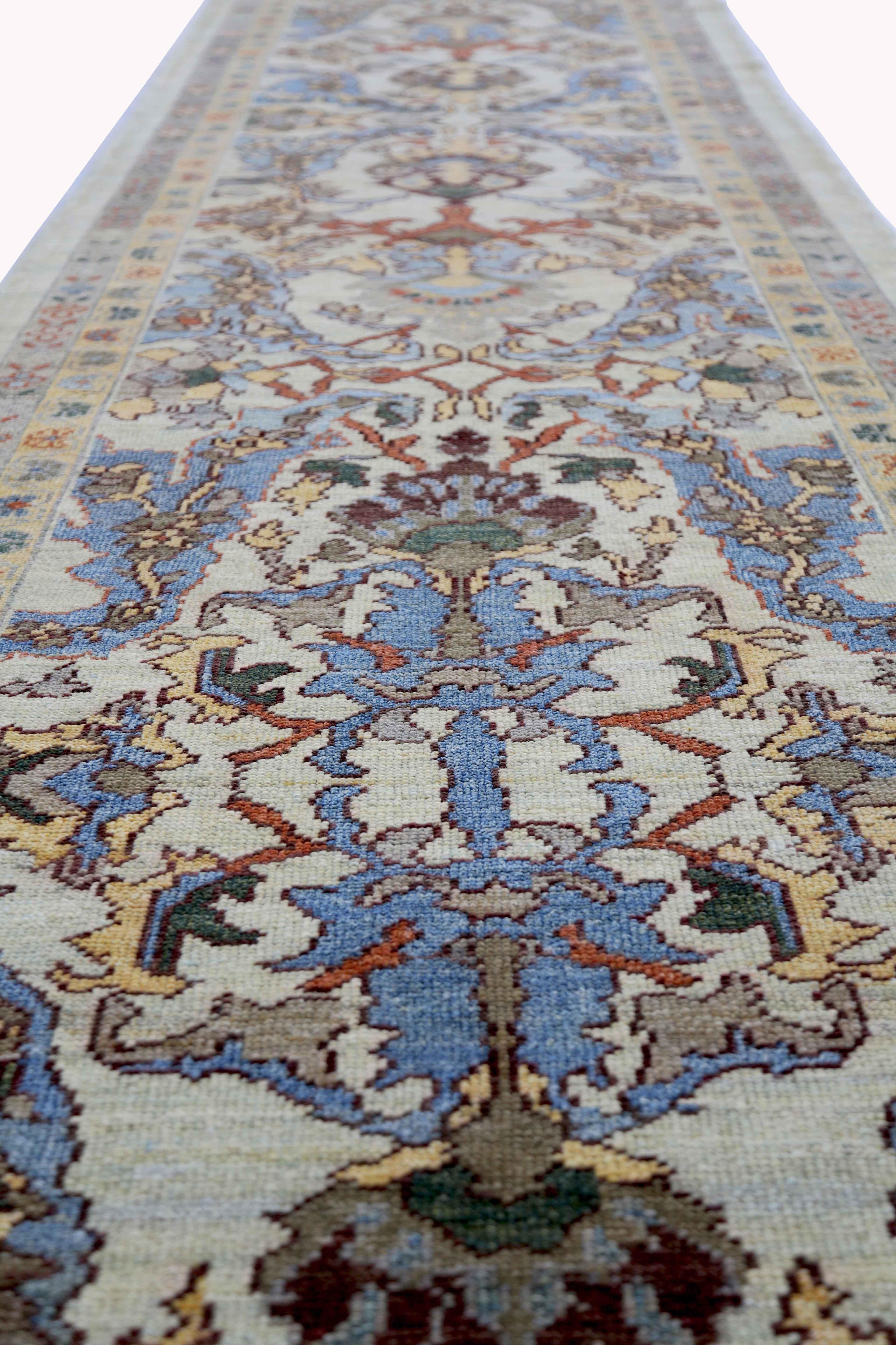 New Turkish rug made of handwoven sheep’s wool of the finest quality. It’s colored with organic vegetable dyes that are certified safe for humans and pets alike. It features floral details in brown and blue over a lovely ivory field. Flower patterns
