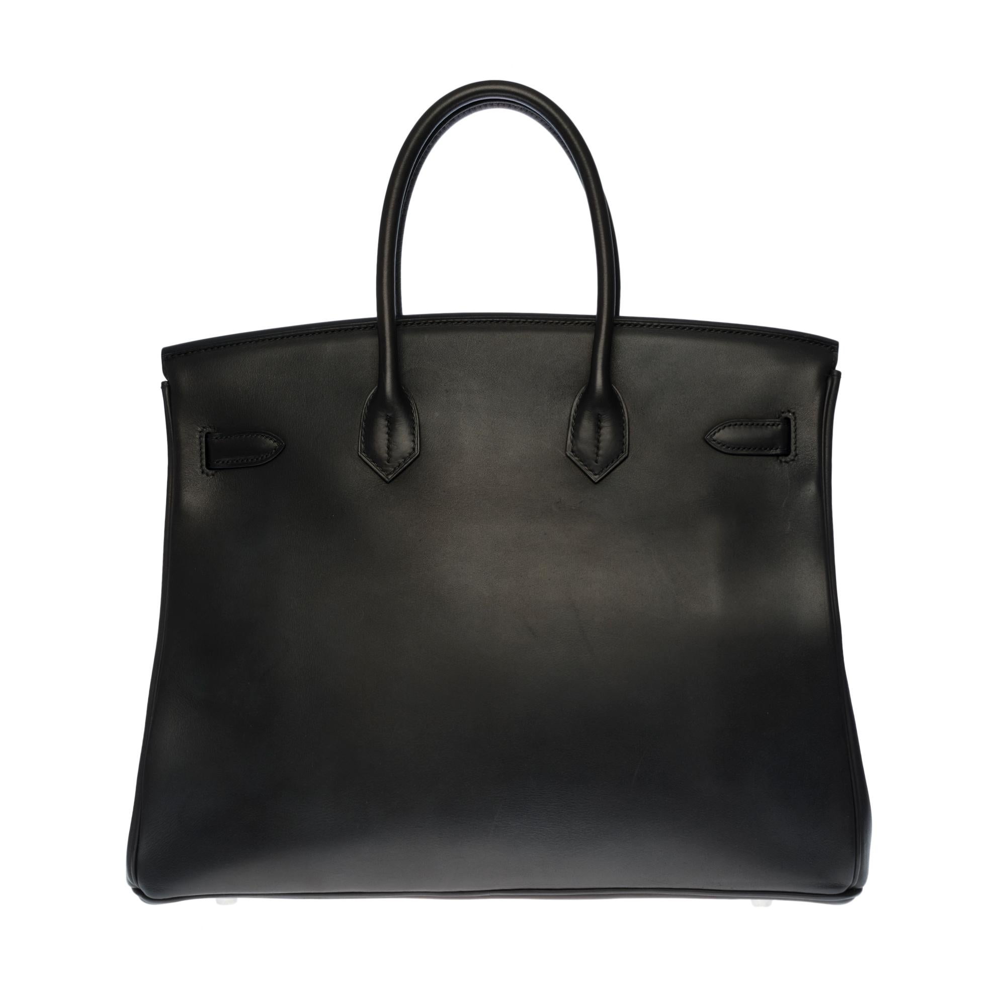 Rare & Exceptional Hermes Birkin 35 cm handbag in Barenia Black leather, palladium silver metal hardware, double handle in black leather allowing a handstand
Flap closure
Black leather lining, one zip pocket, one patch pocket
Signature: 