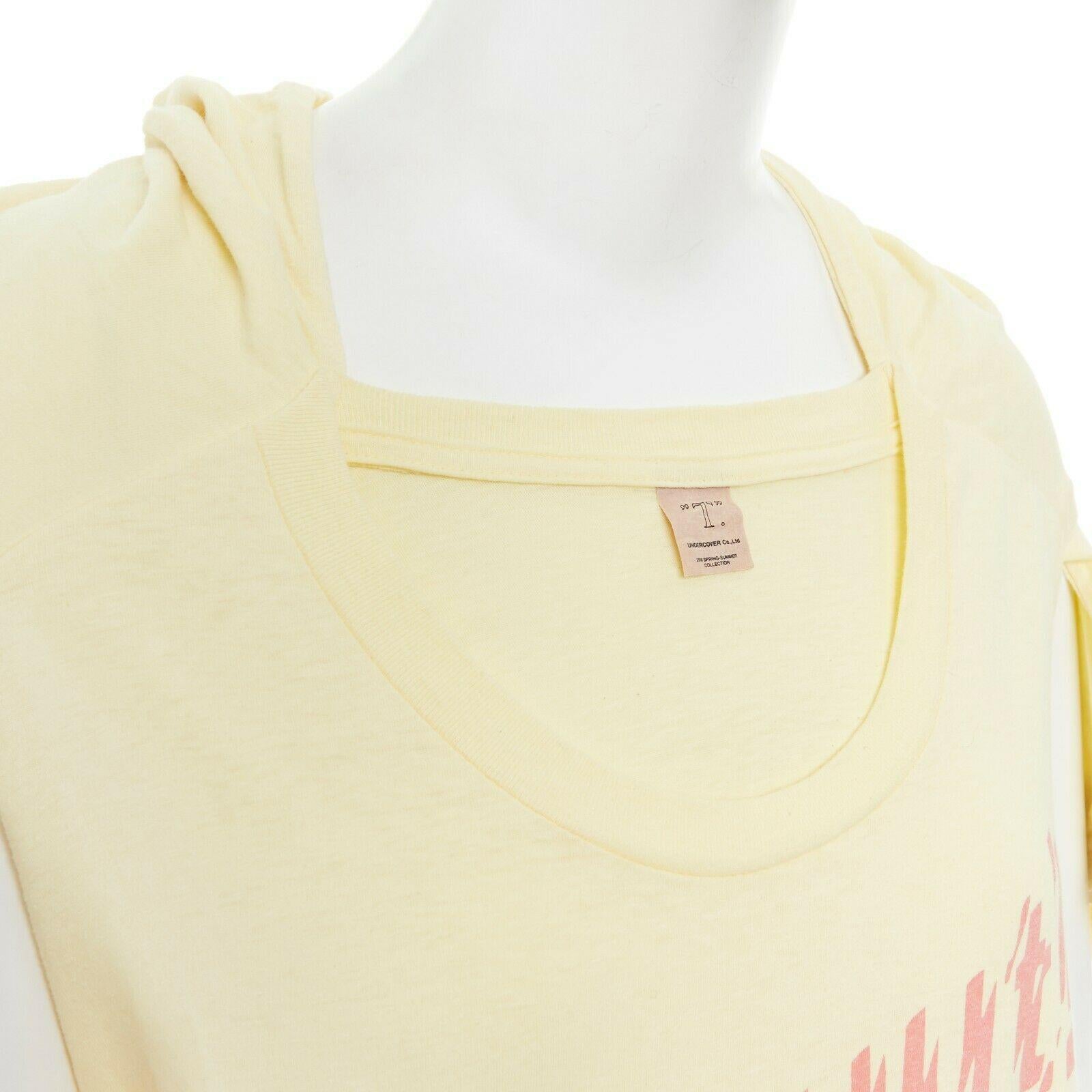 new UNDERCOVER Chuut! print yellow cotton deconstructed  t-shirt tunic top JP2 M
UNDERCOVER
100% cotton. Pale yellow. 
Deconstructed and reconstructed from two t-shirt designs. 
Designed to look like a t-shirt was laid at the front. 
Short sleeves.