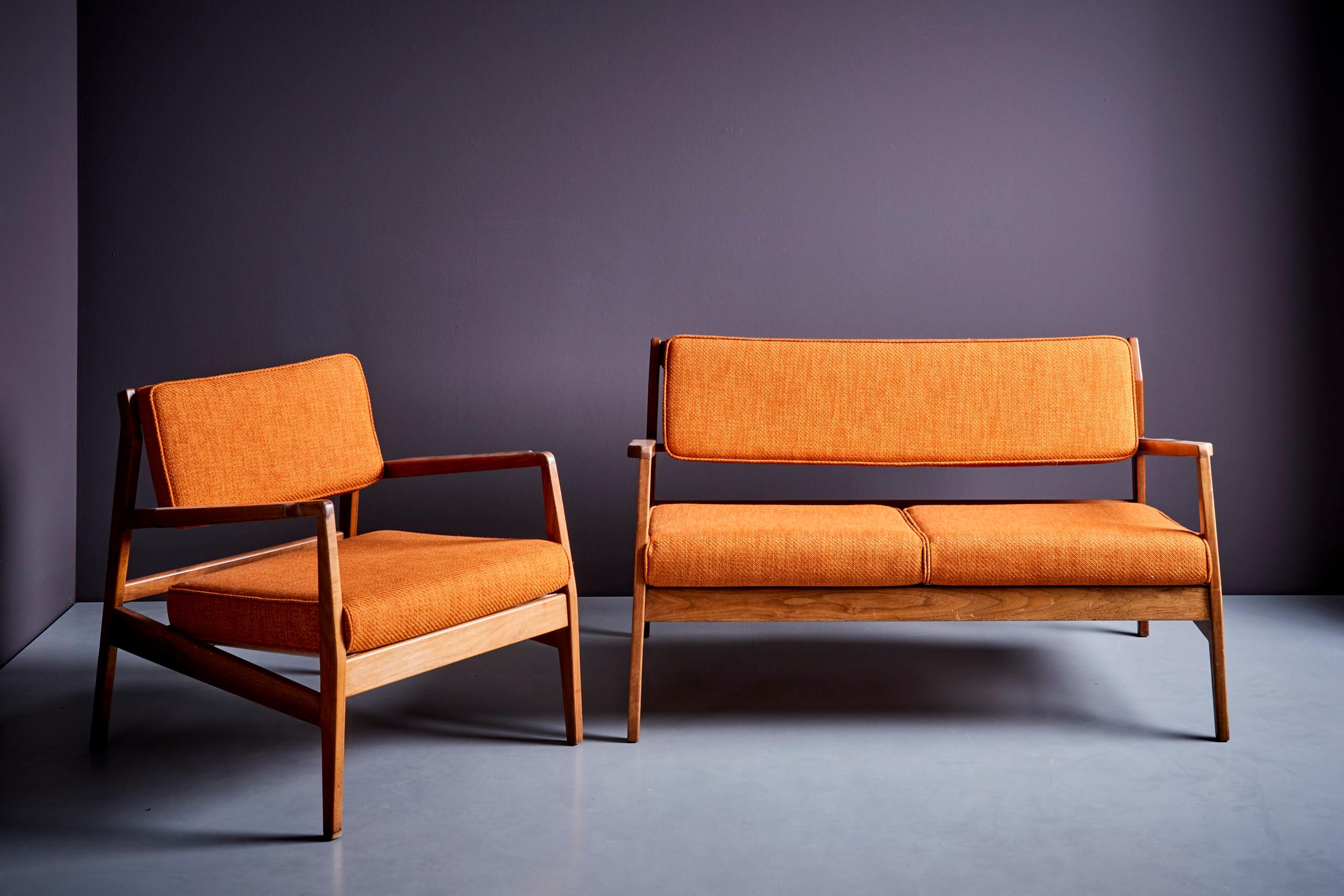 Excellent set by Jens Risom in fully restored condition. The fabric is an orange yellow Missoni fabric with new foam and restored walnut frame.

