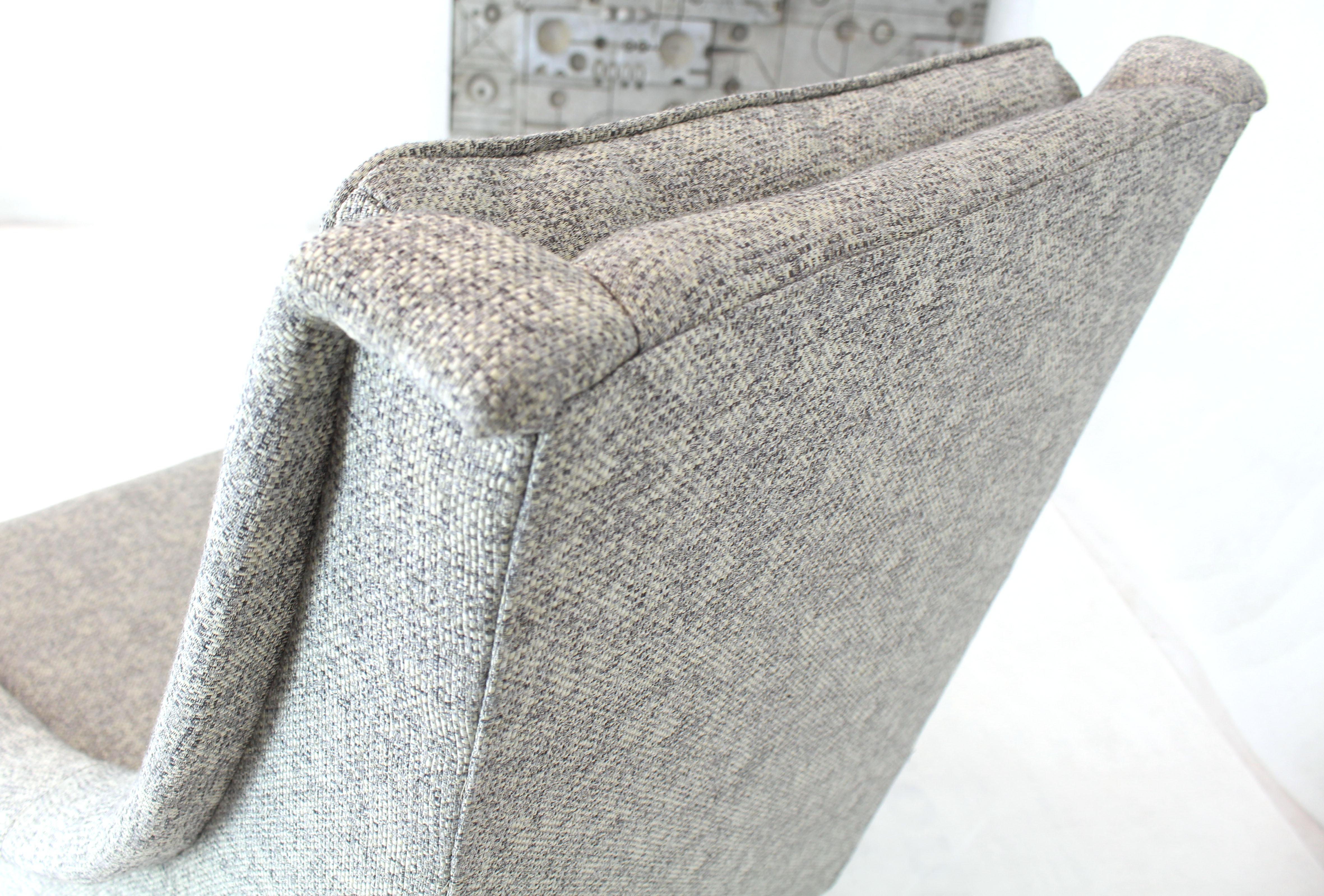 New grey basket weave fabric upholstery Mid-Century Modern lounge chair on dowel legs.