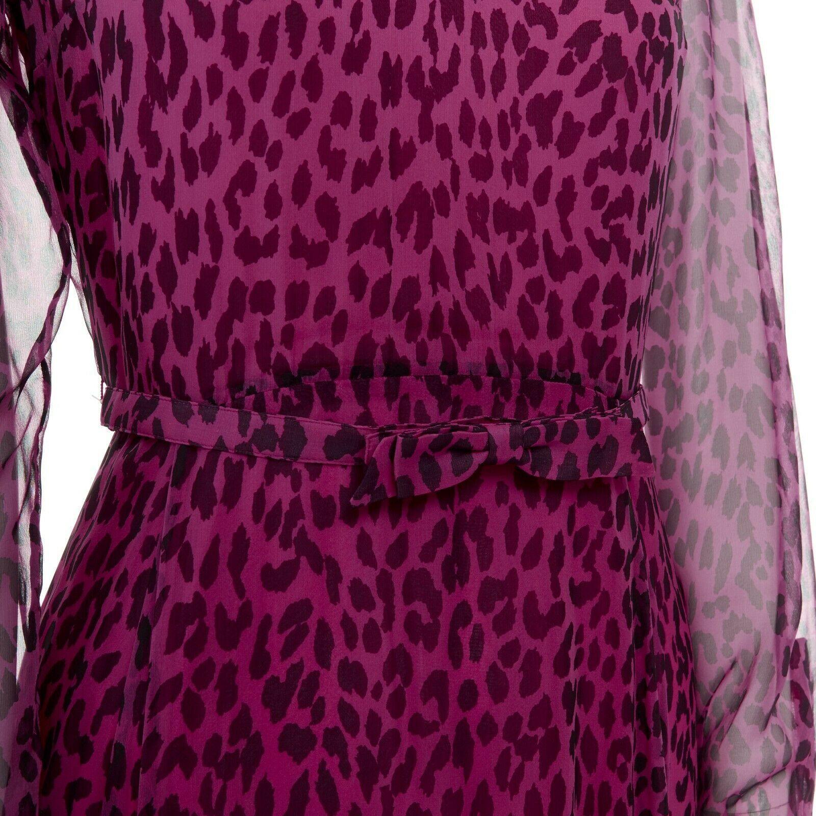 new VALENTINO 2013 pink black leopard silk long sleeves belted evening gown IT40
VALENTINO
FROM THE RESORT 2013 COLLECTION100% silk. 
Pink and black leopard spot print. Round neck. 
Long sleeves. Single button cuff. 
Bow applique skinny belt detail