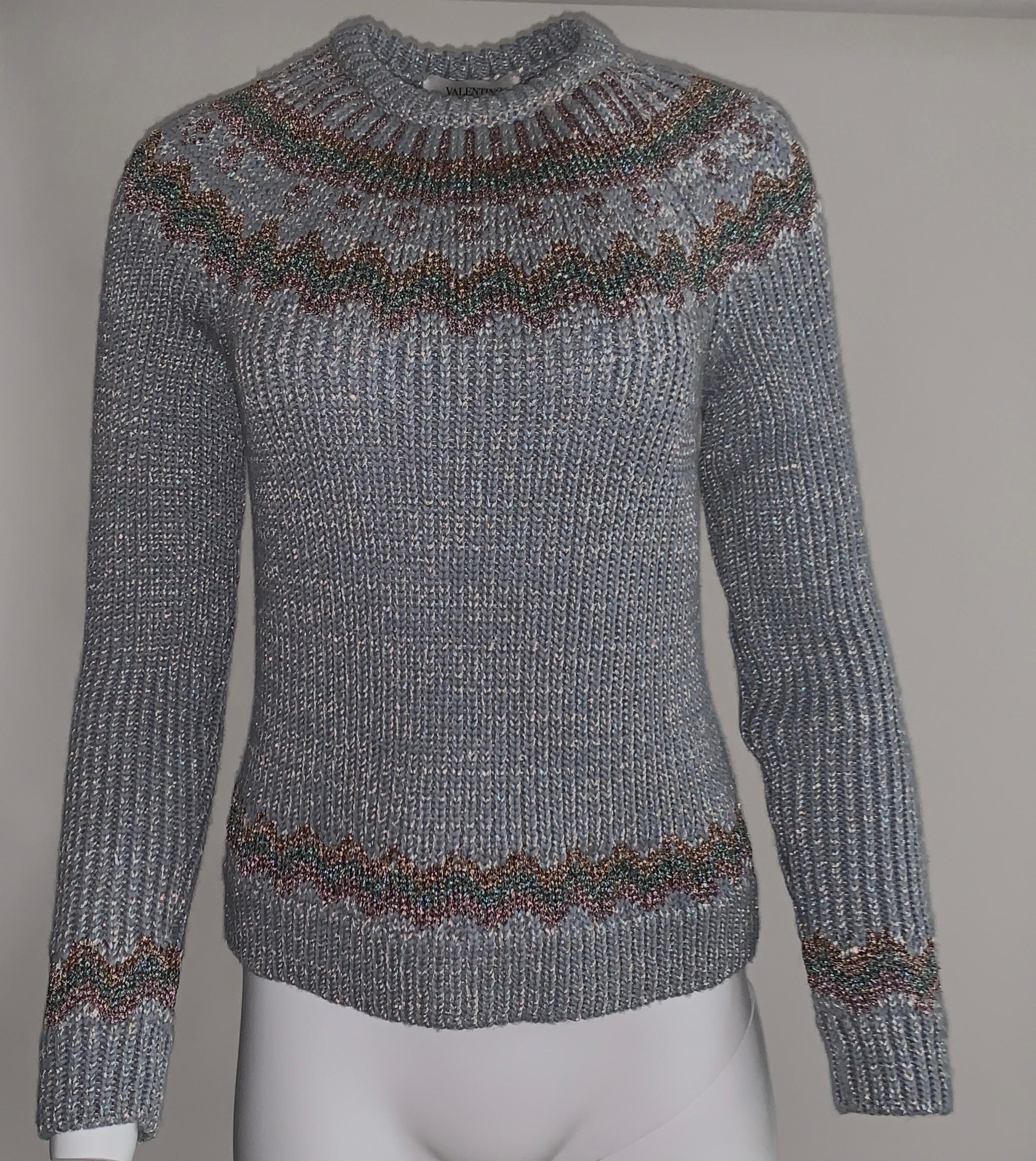 Valentino wide rib knit grey grey sweater with metallic pink and turquoise fair isle detailing and silver metallic accents throughout. Crew neck, long sleeve.

43% viscose, 42% wool, 15% metallic.

Made in Italy.

Size XL, may run a bit small, see